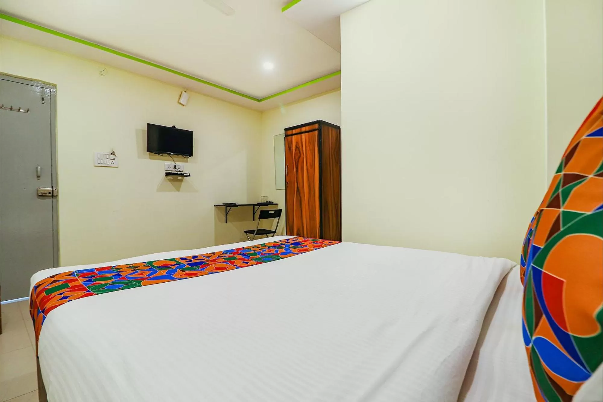 Communal lounge/ TV room, Bed in FabExpress Broholic Suites - Nr JNTU Kukatpally