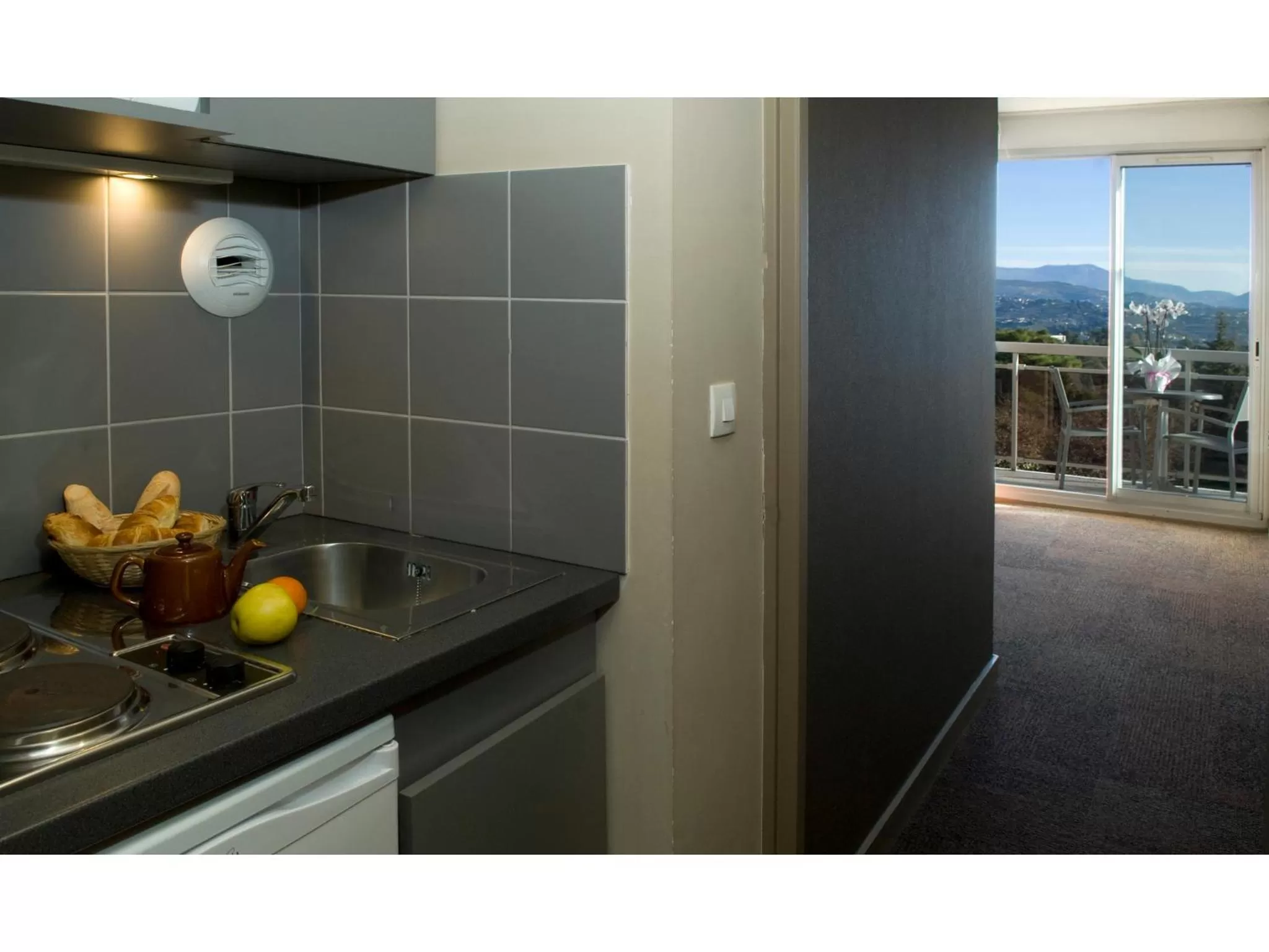 Kitchen or kitchenette in Hôtel Du Baou