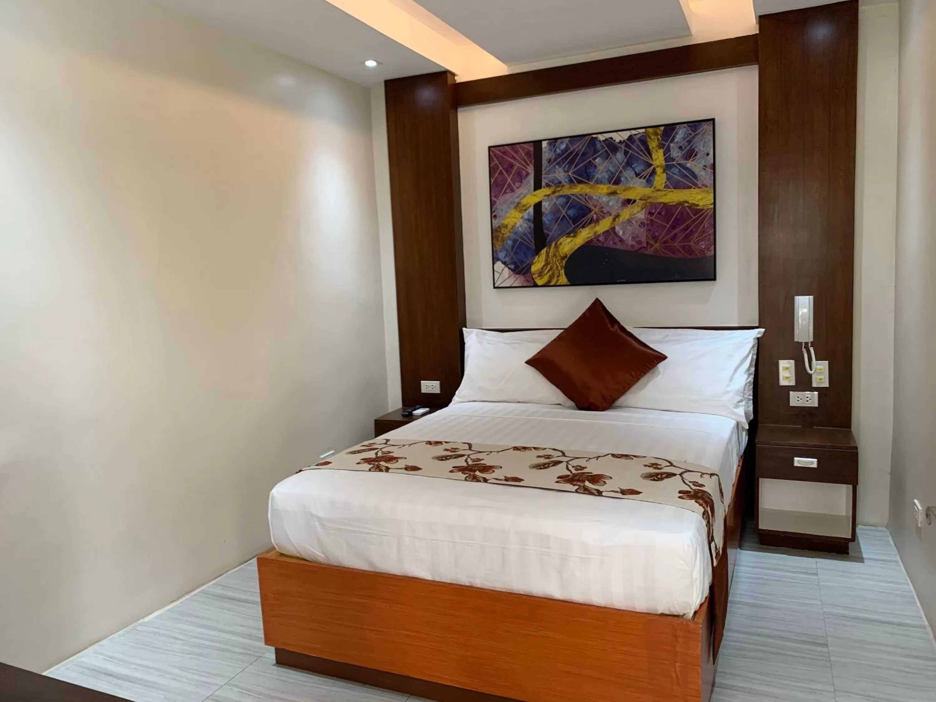 Bed in Rustic Crown Hotel