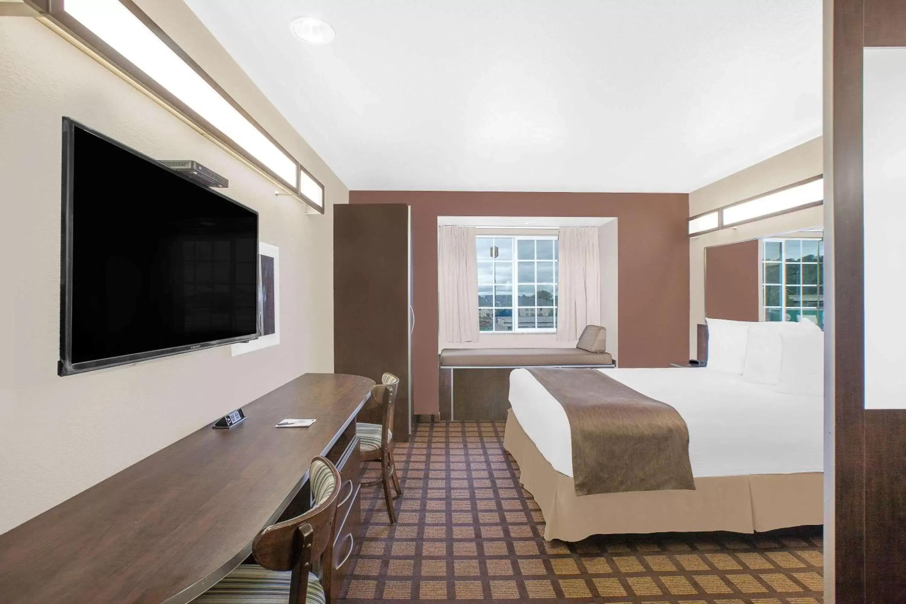 Photo of the whole room, TV/Entertainment Center in Microtel Inn & Suites By Wyndham Conway