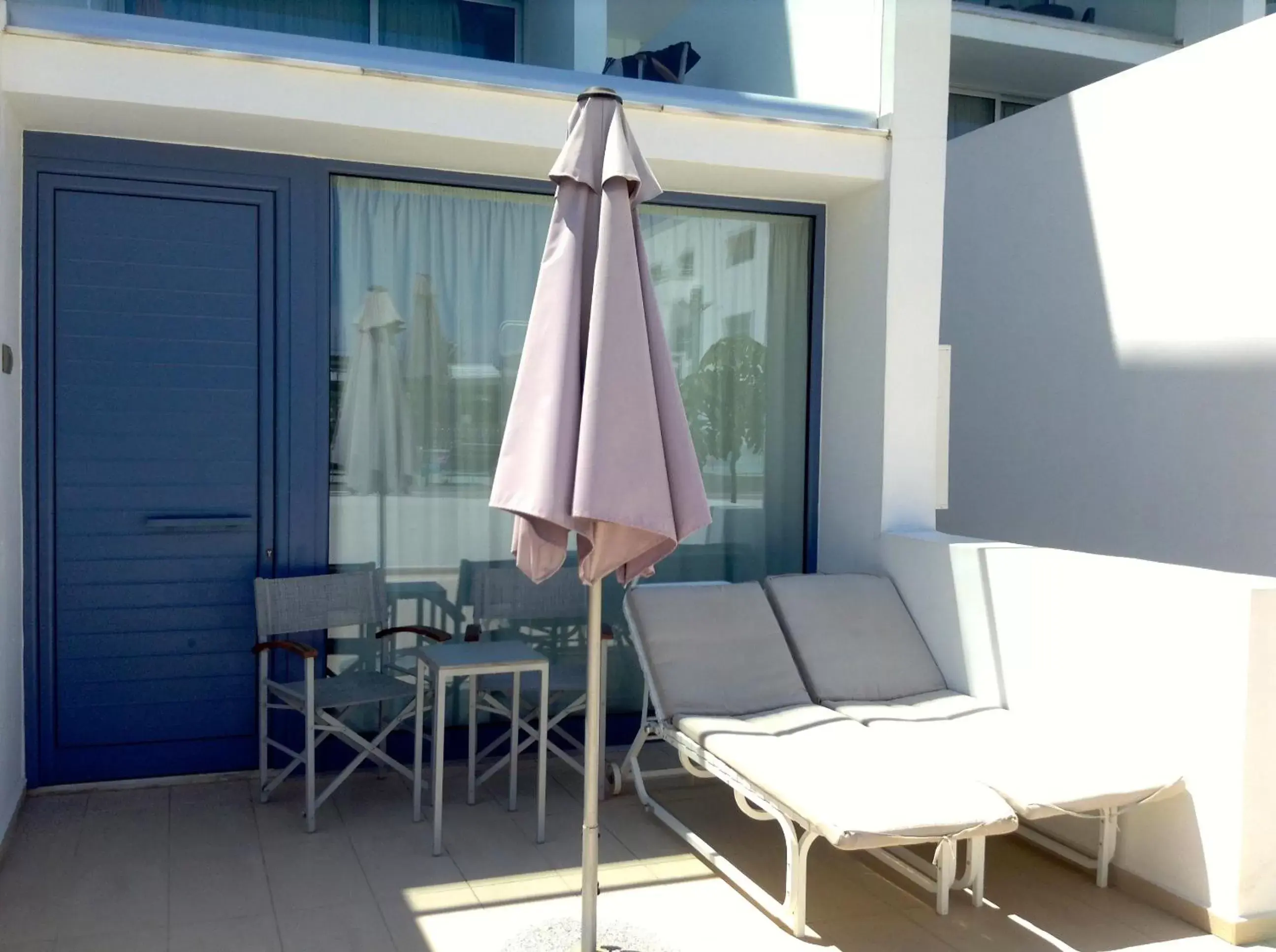 Patio, Dining Area in Limanaki Beach Hotel & Suites