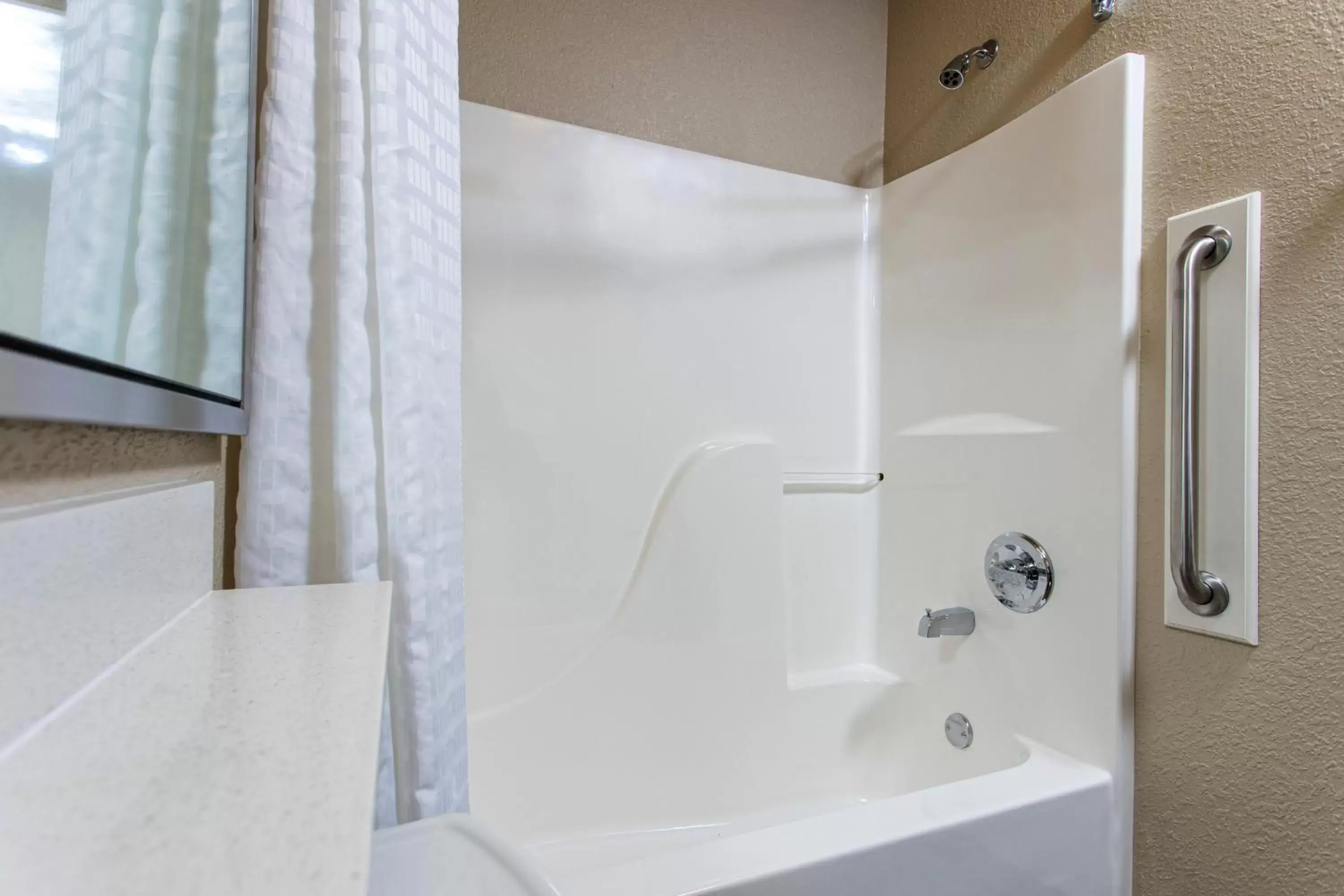 Shower, Bathroom in Candlewood Suites Appleton, an IHG Hotel