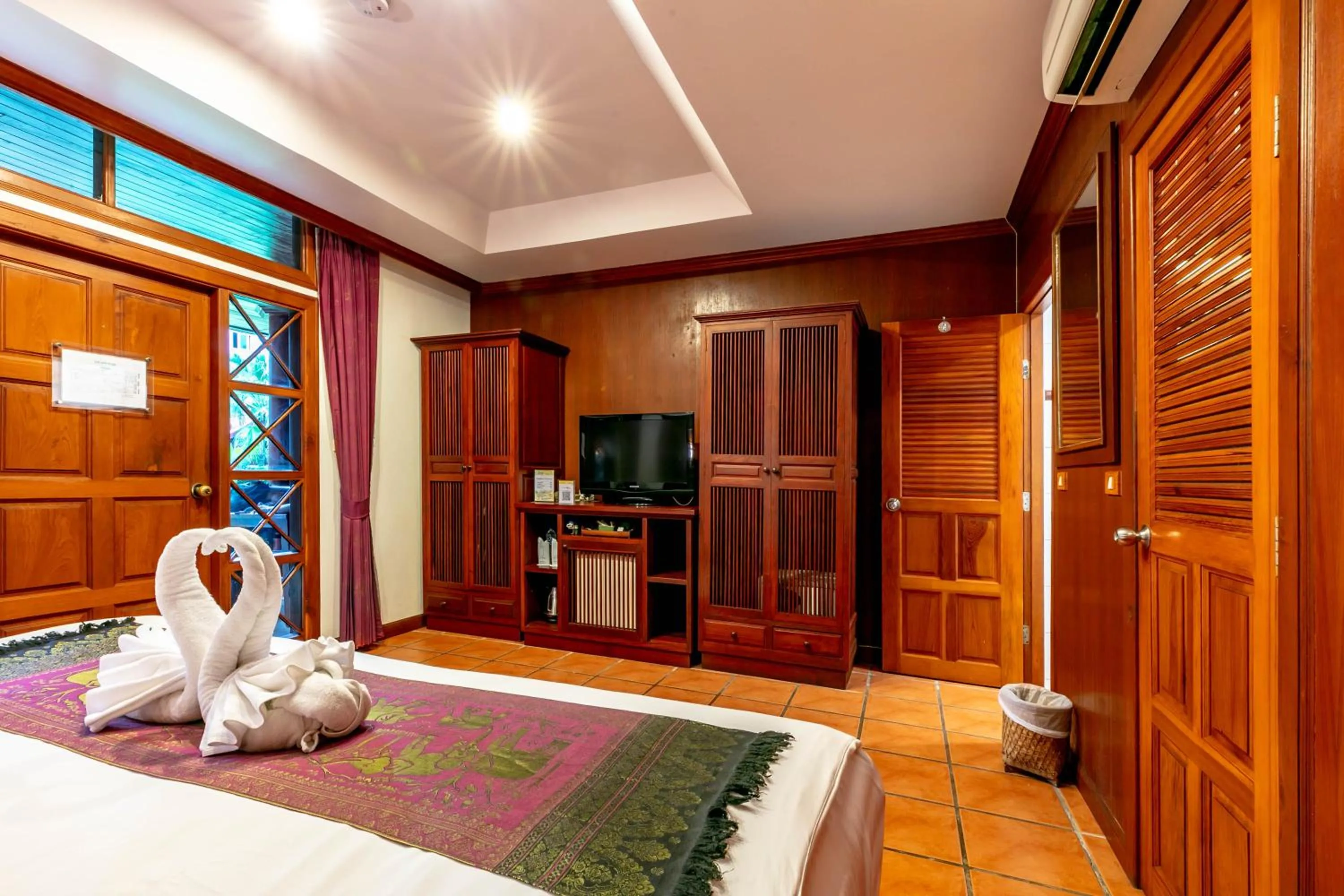 Photo of the whole room, Bed in Royal Phawadee Village Patong - 2 Minutes walk to the beach