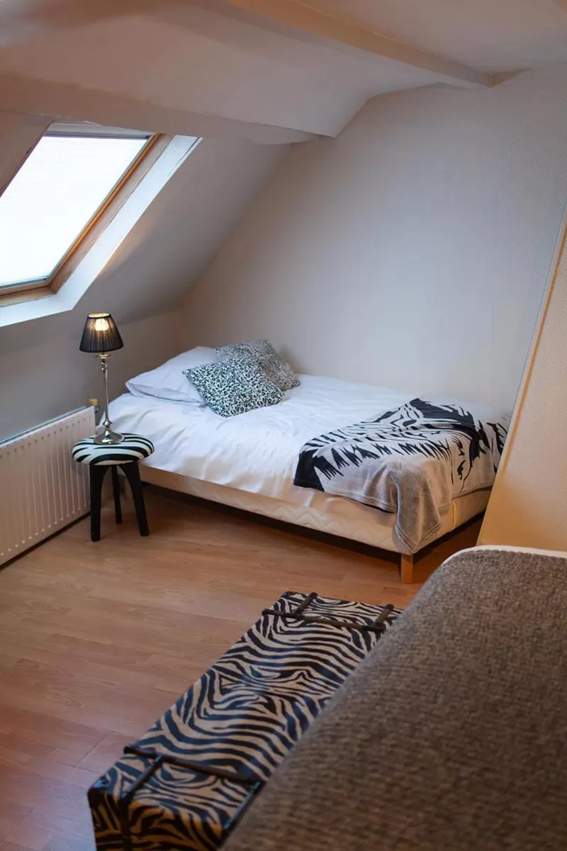 Bed in Bienvenue Chez Nous