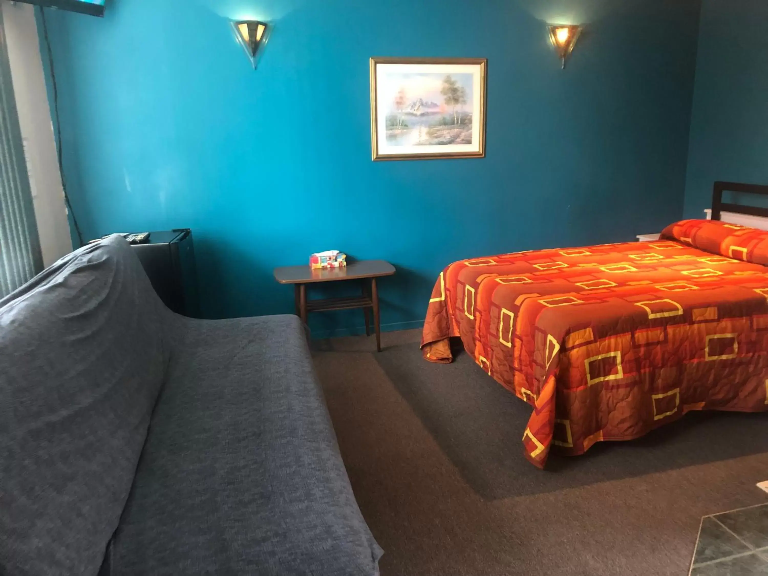 Bed in Motel Le Voyageur