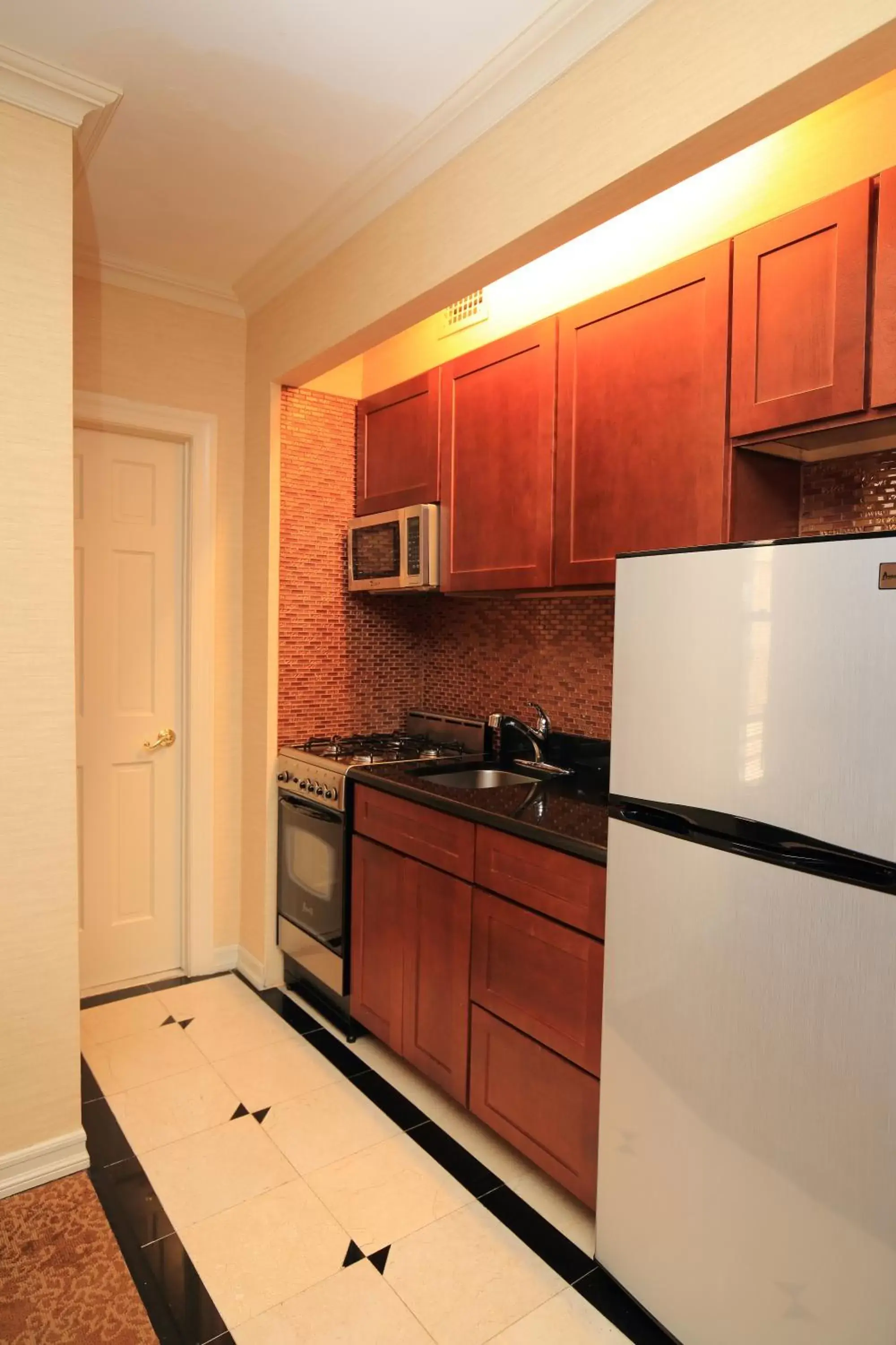Kitchen or kitchenette in Radio City Apartments