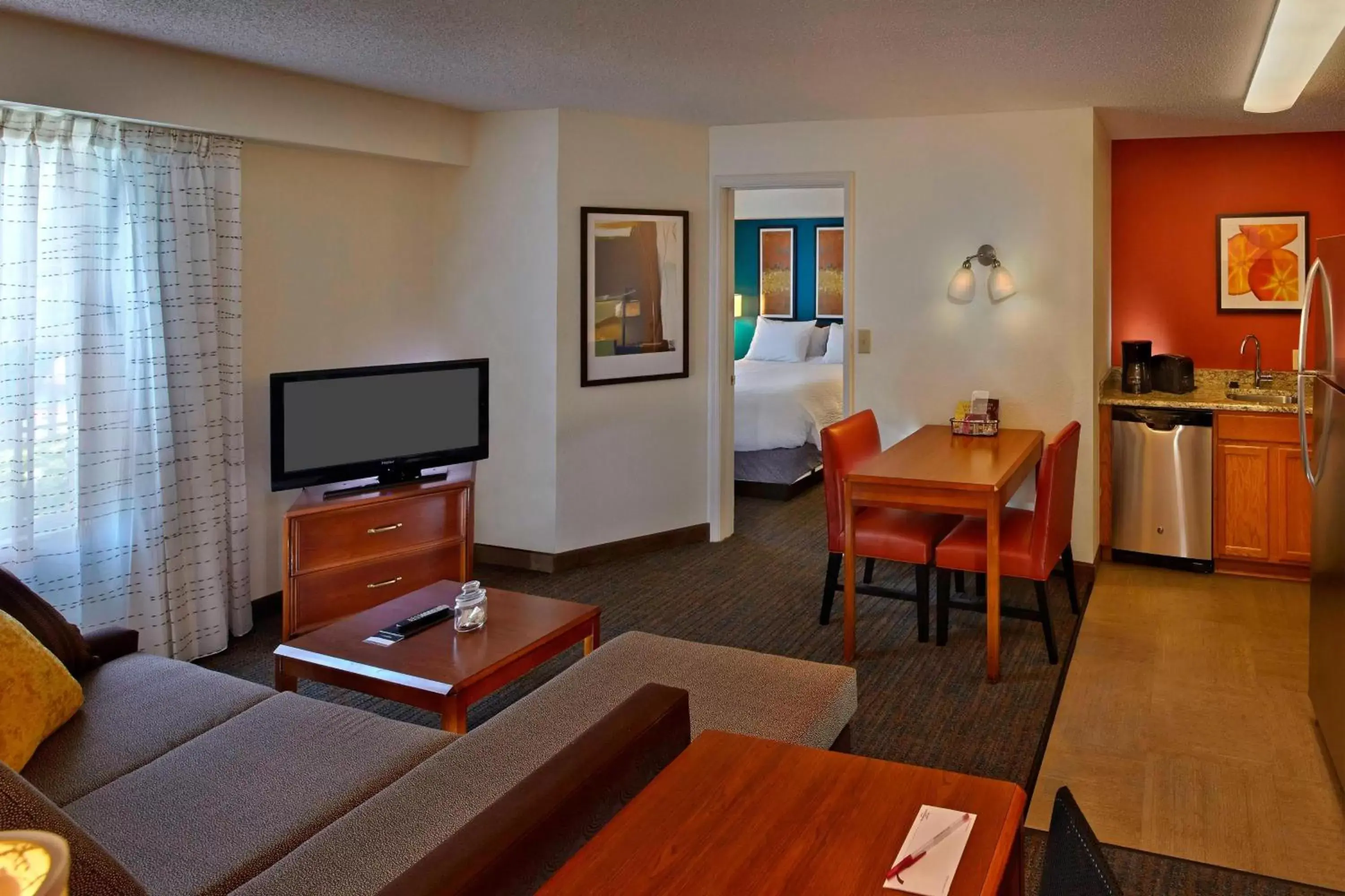 Bedroom, TV/Entertainment Center in Residence Inn by Marriott Orlando East/UCF Area