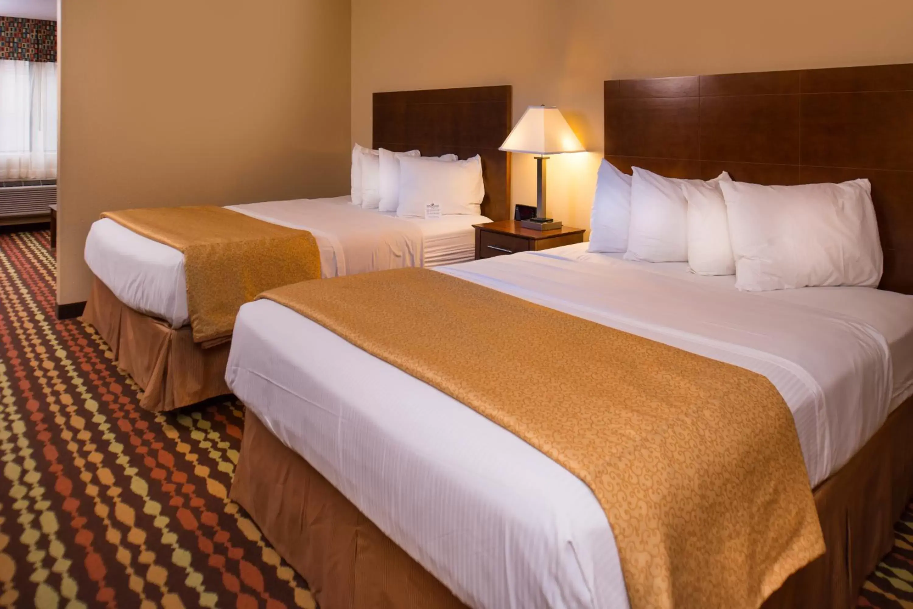 King Room with One King Bed and Two Queen Beds - Non-Smoking in Best Western Ambassador Inn & Suites