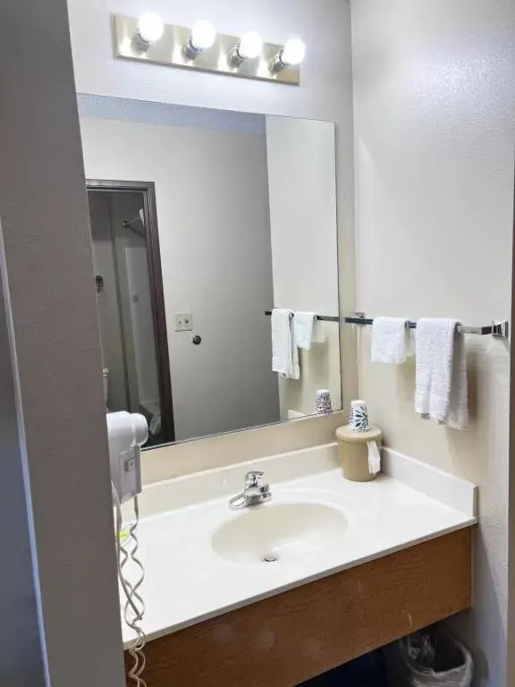 Bathroom in Designer Inn and Suites