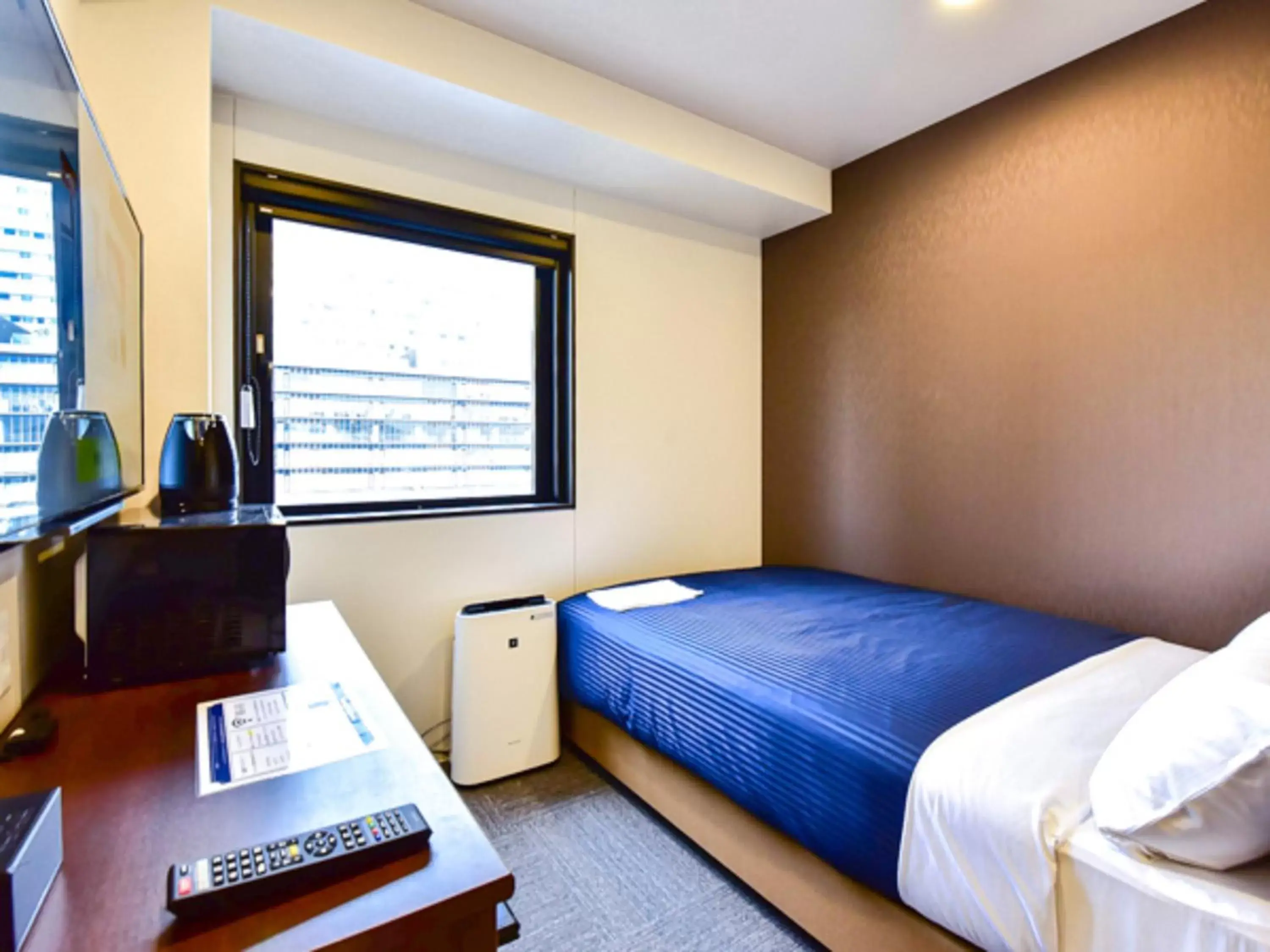 Bed in HOTEL LiVEMAX Okayama West