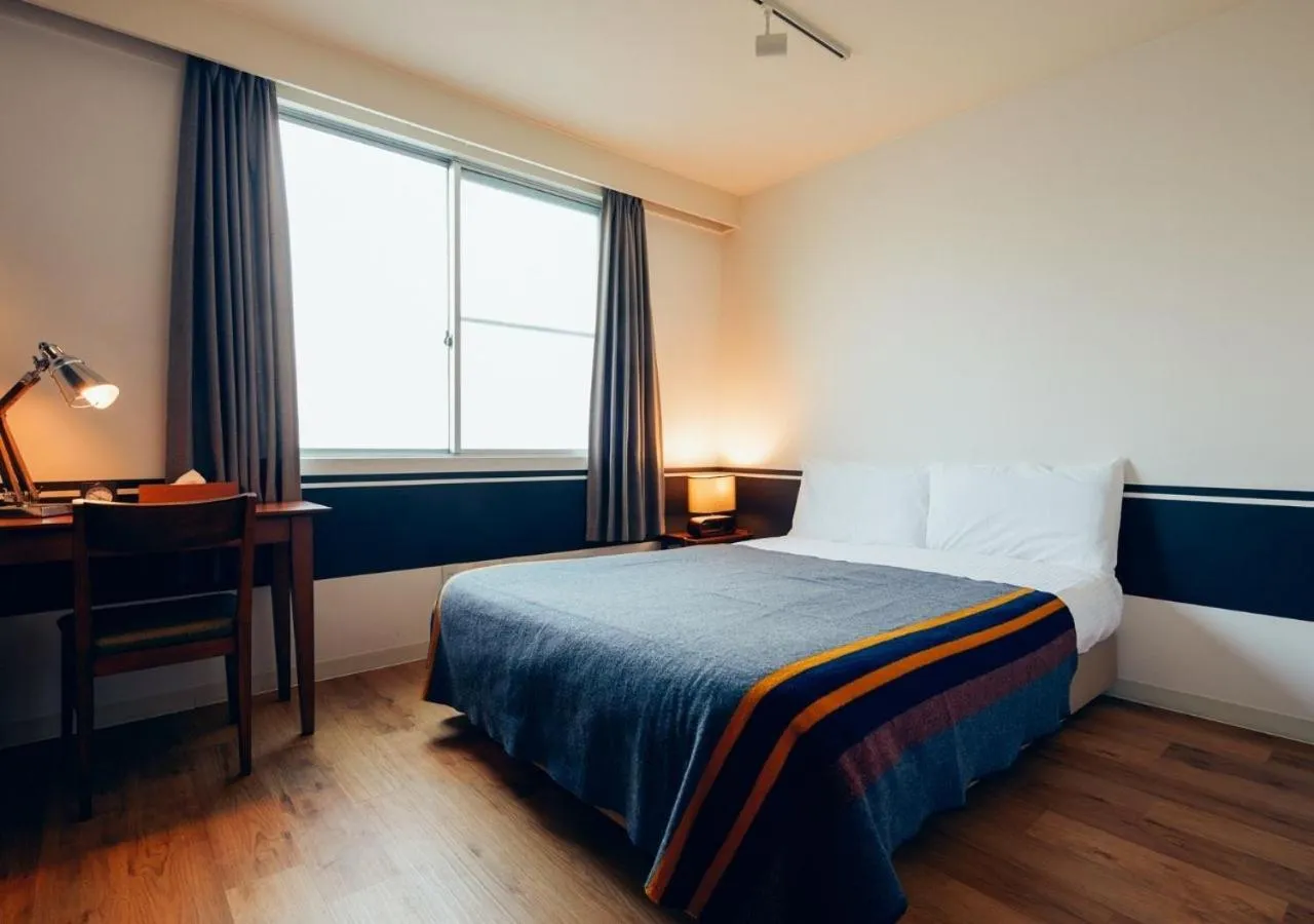 Bed in Hotel Graphy Nezu
