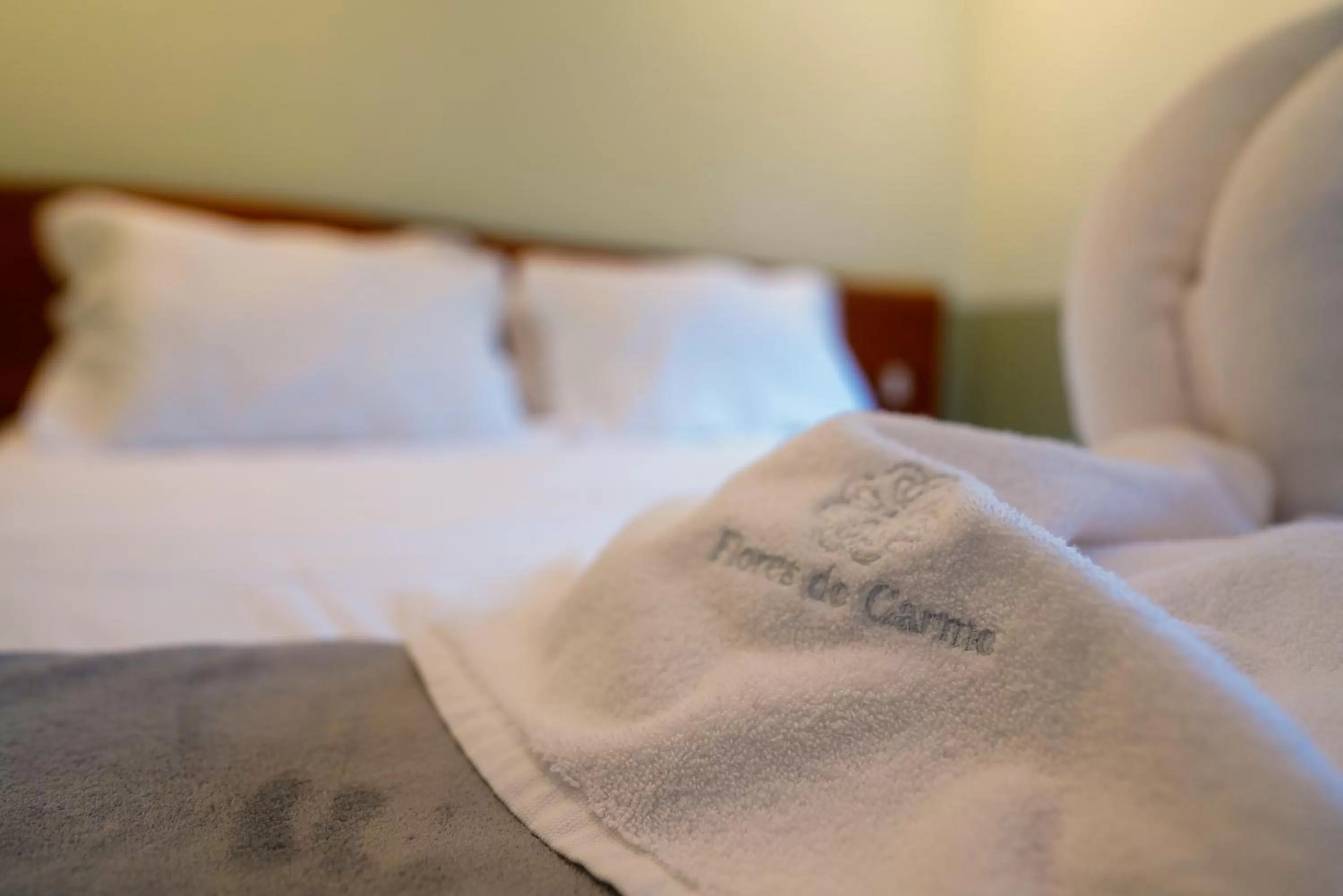 Bed in Pousada Flores do Carmo