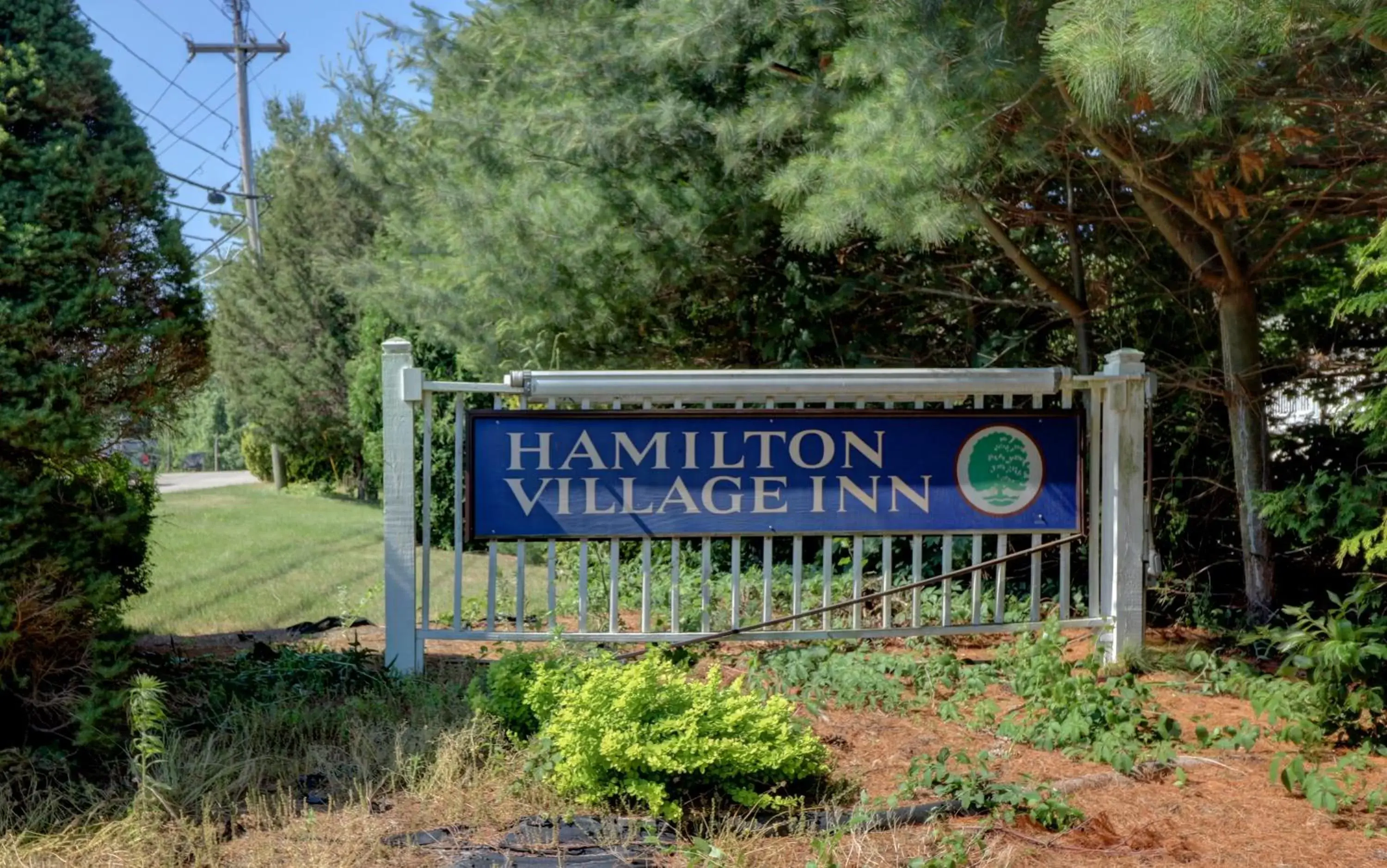 Property logo or sign in Hamilton Village Inn
