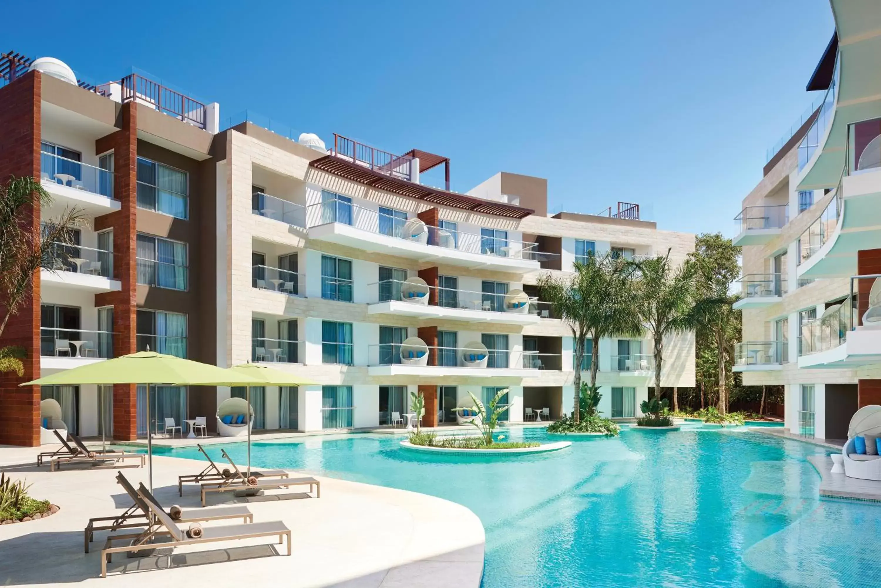 Swimming pool, Property Building in The Fives Beach Hotel & Residences - All Senses Inclusive