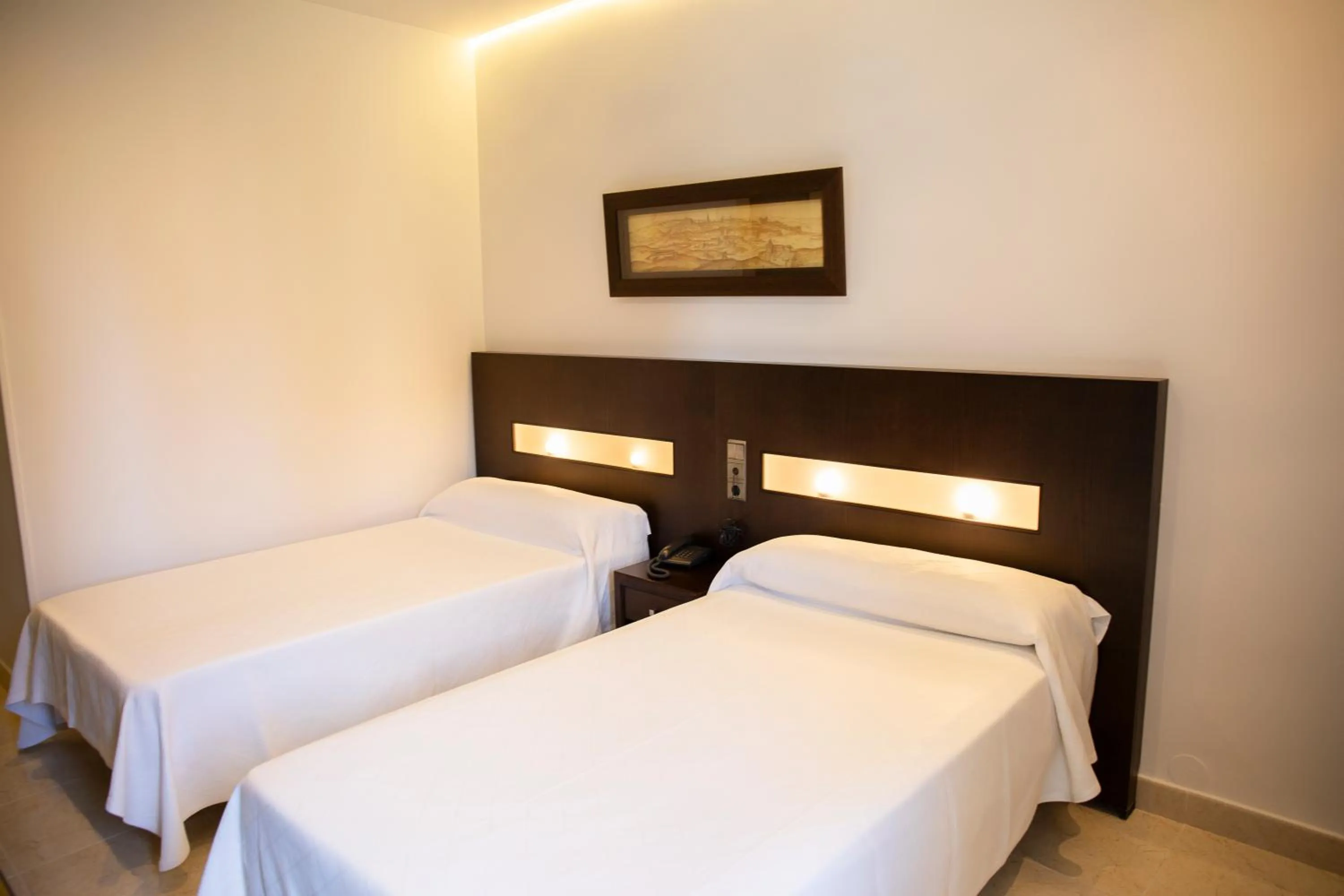 Bed in Hotel El Mesón