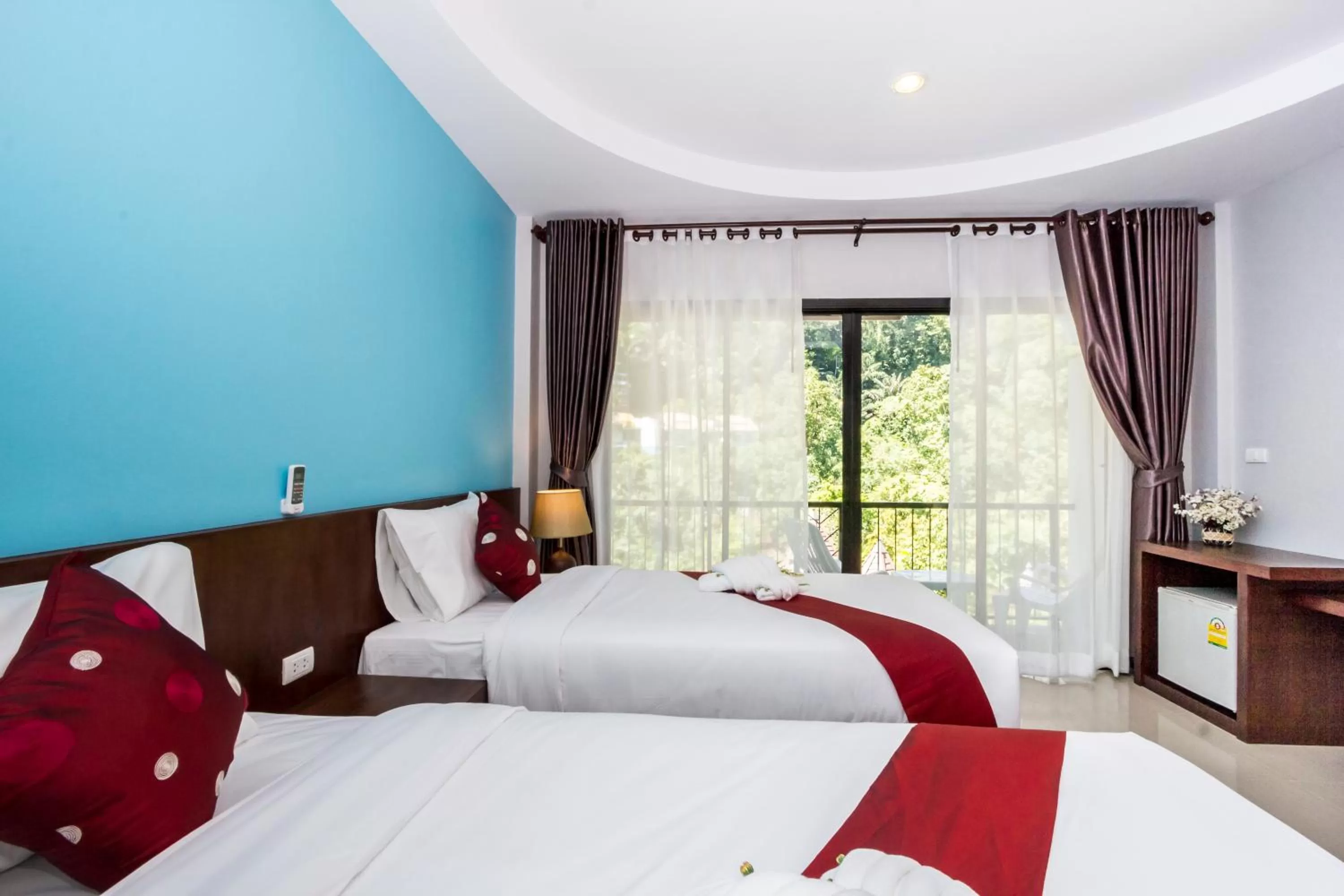 Bed in Andaman Pearl Resort