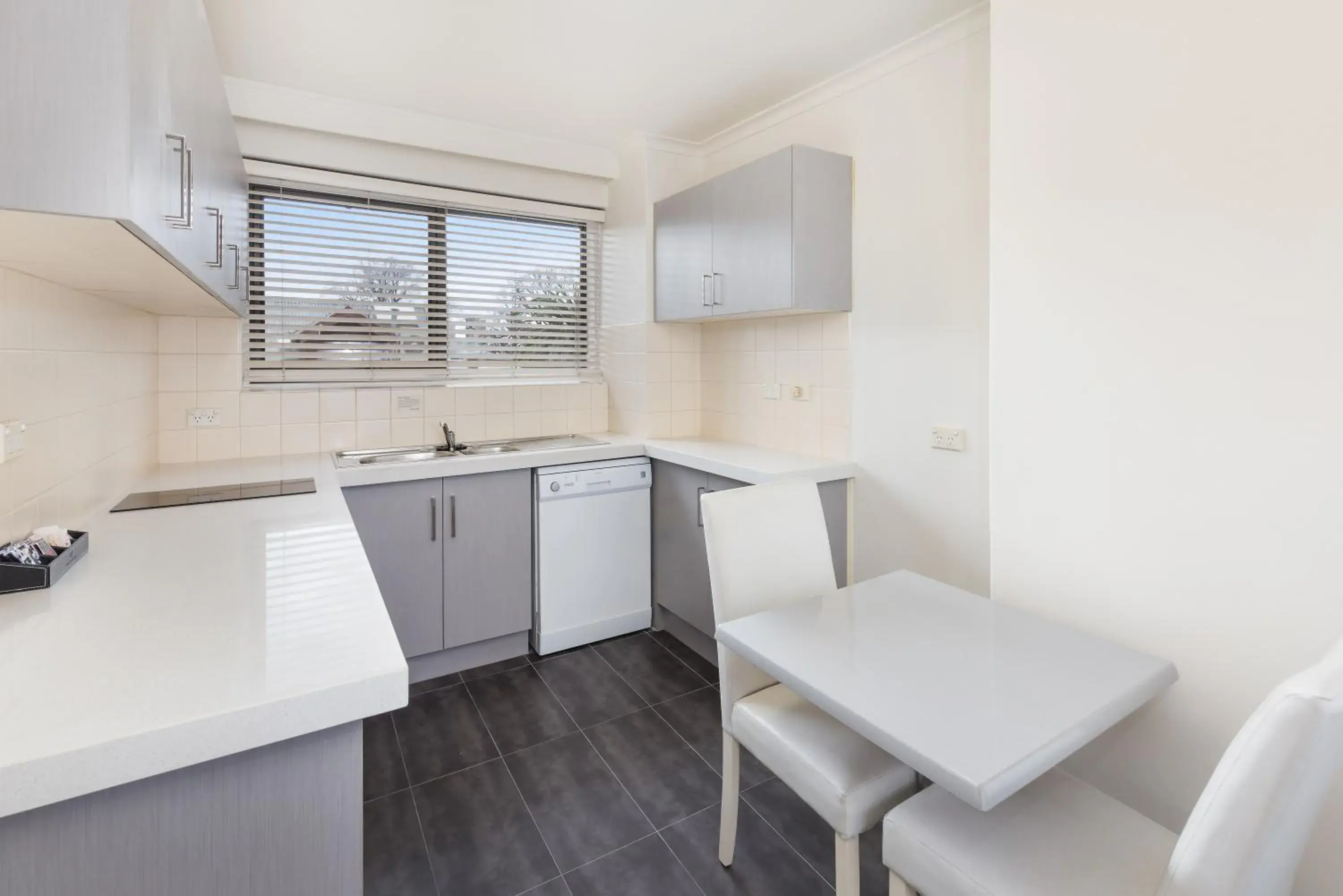 Kitchen or kitchenette in City Edge East Melbourne Apartment Hotel
