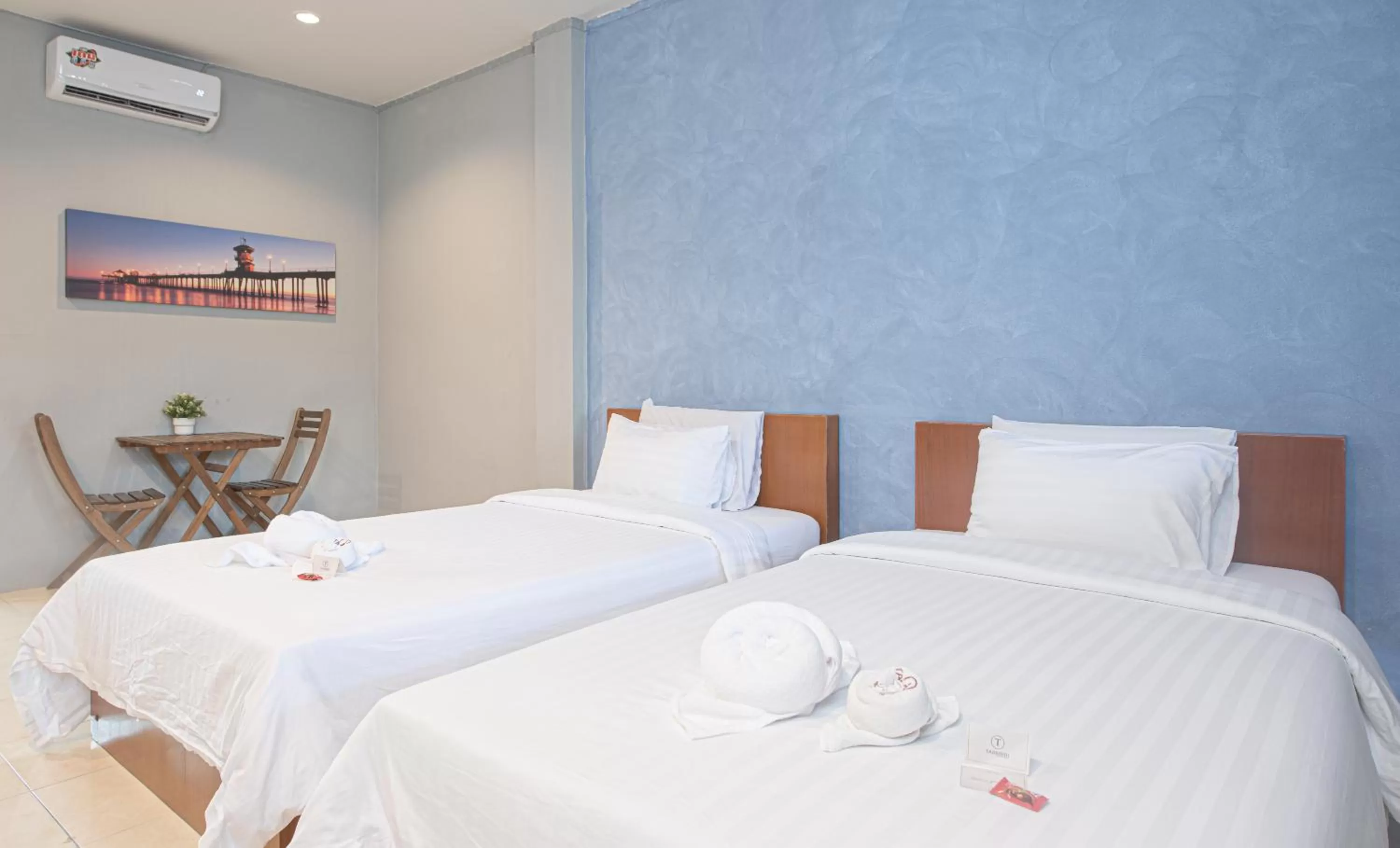 Bed in Tarnsiri Boutique Resort