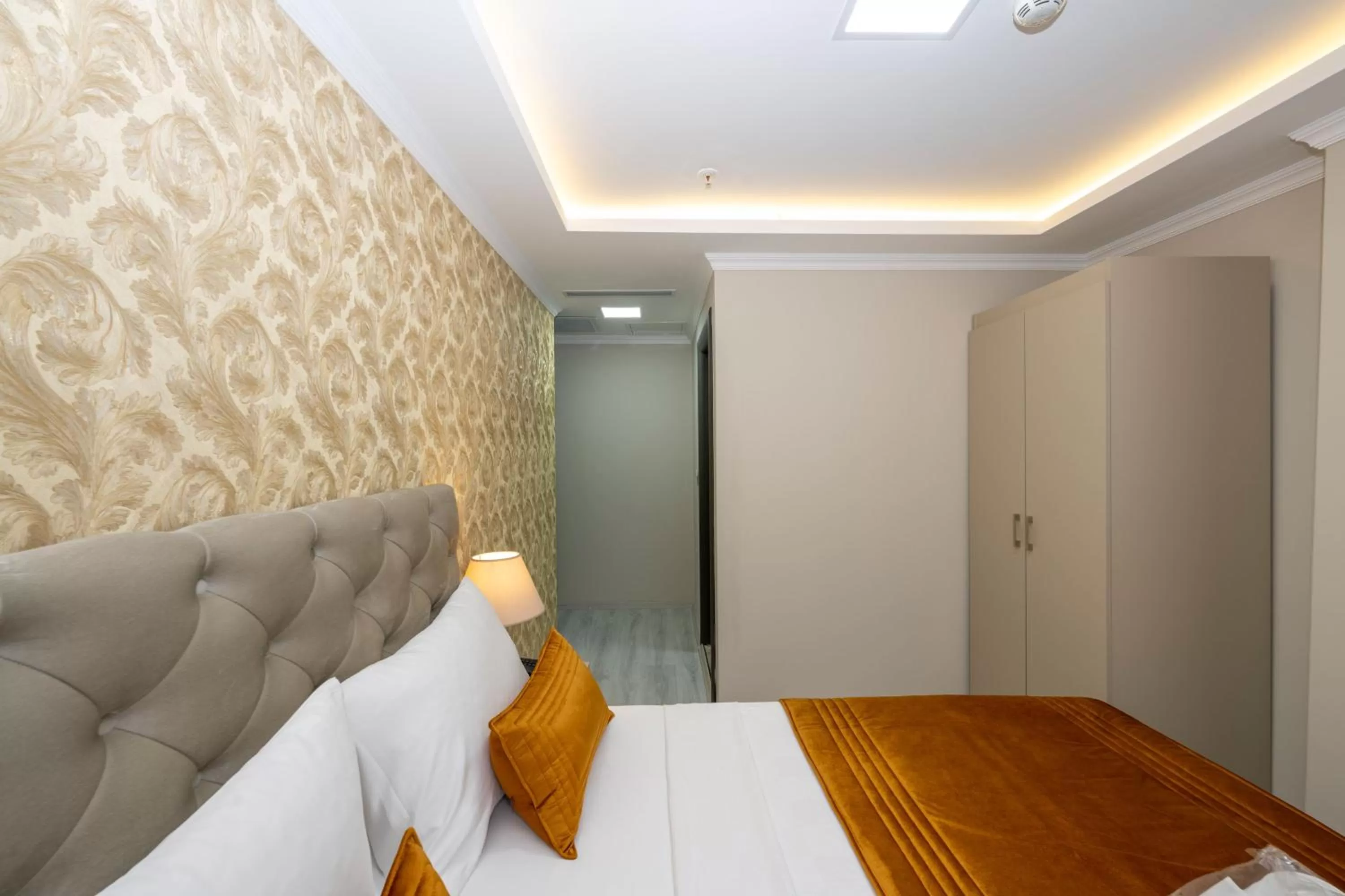 Bed in SKYSTAR DELUXE HOTEL