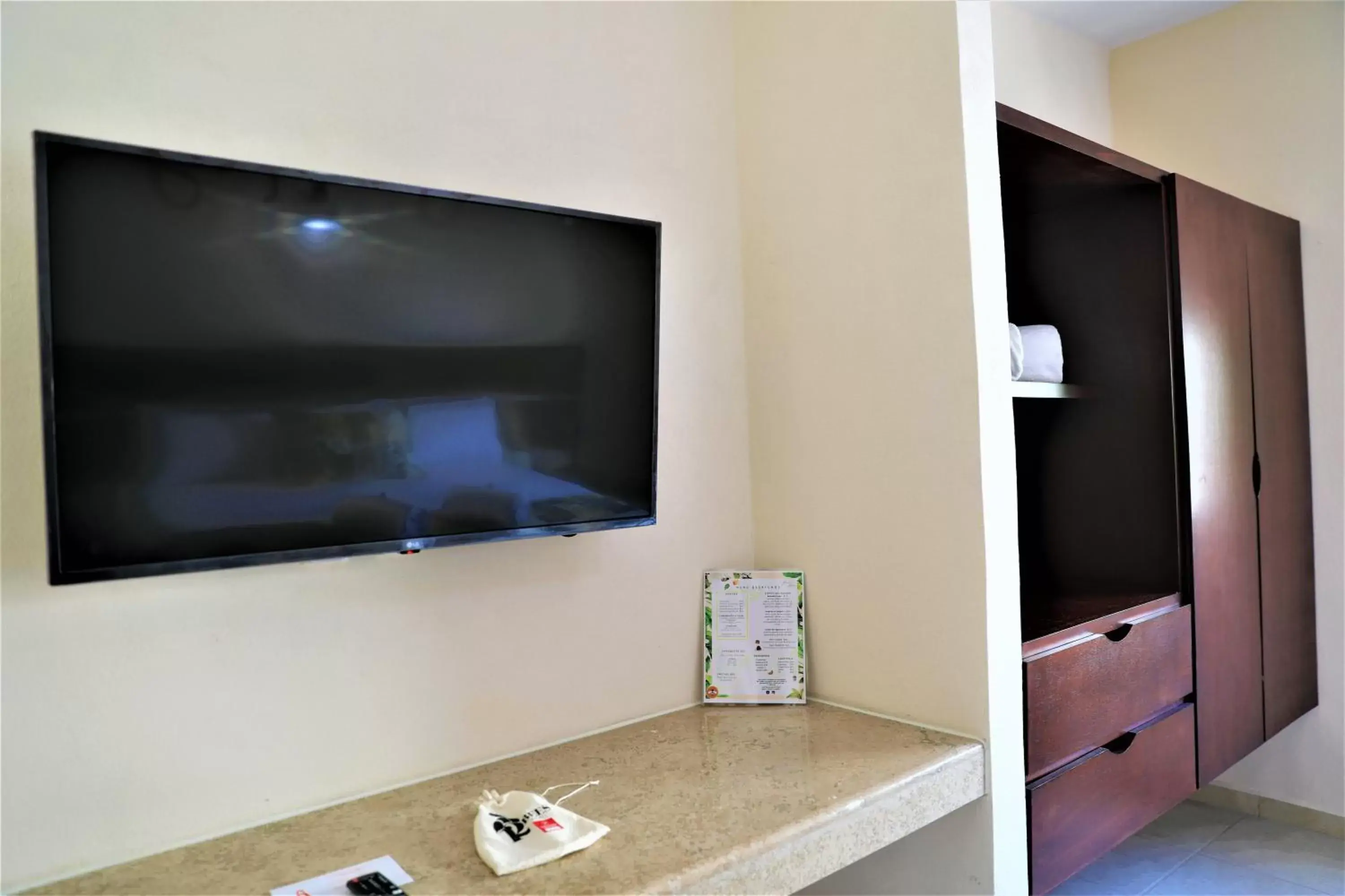 TV and multimedia, TV/Entertainment Center in Hotel 12 BEES by Kavia