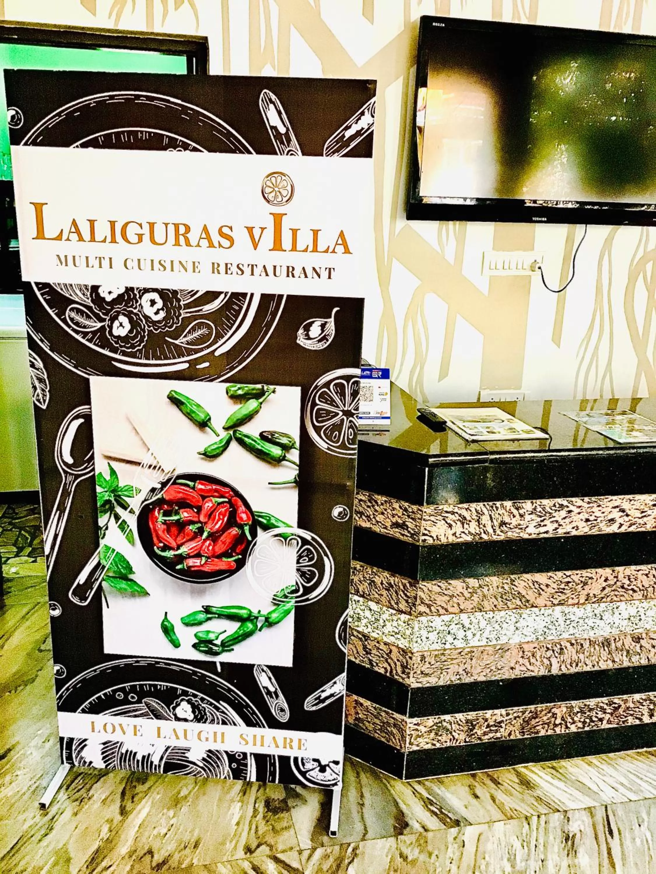 Property logo or sign in LaligurasVilla Beachside Escape - 100m to Beach