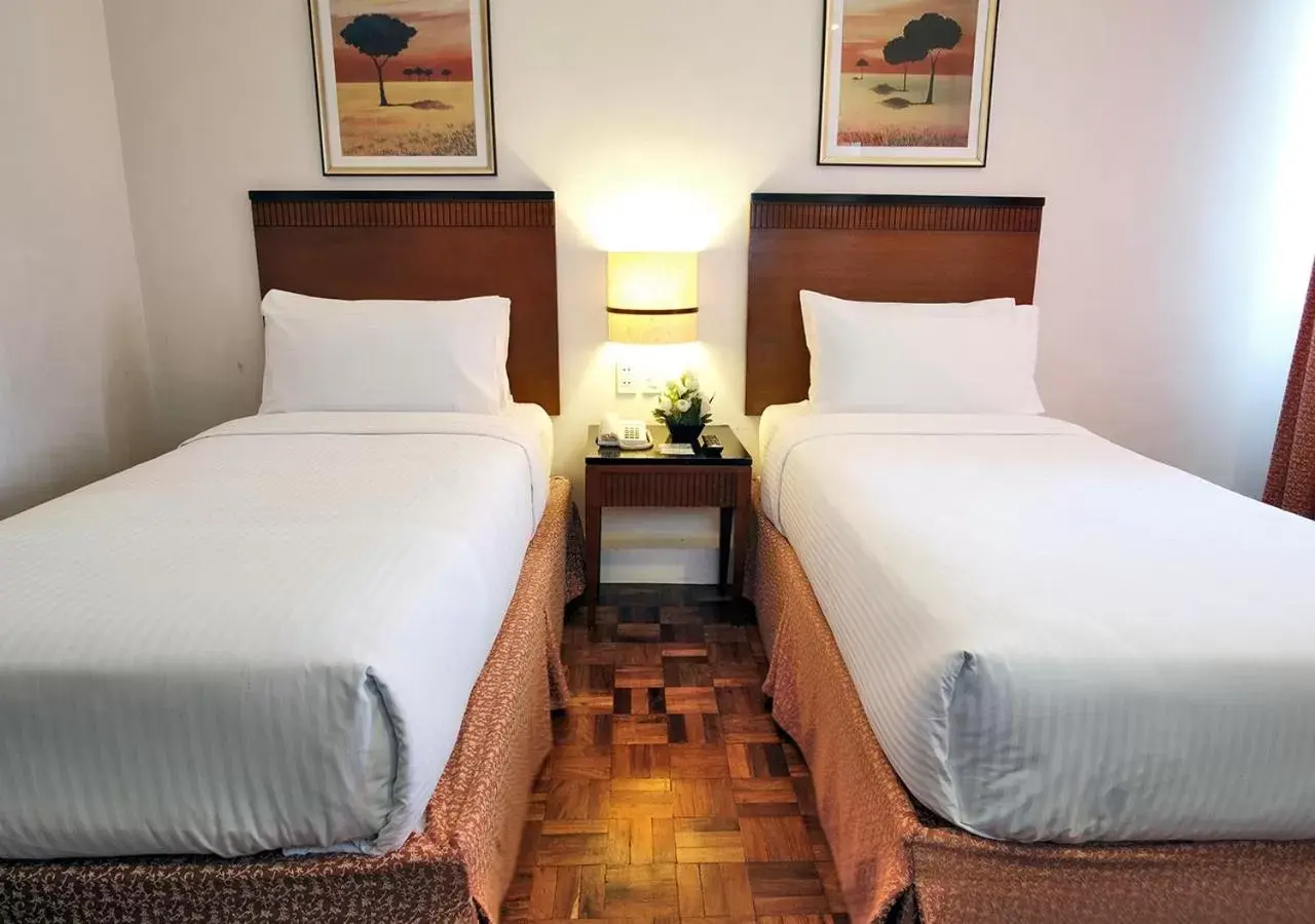 Bed in Fersal Hotel Neptune Makati