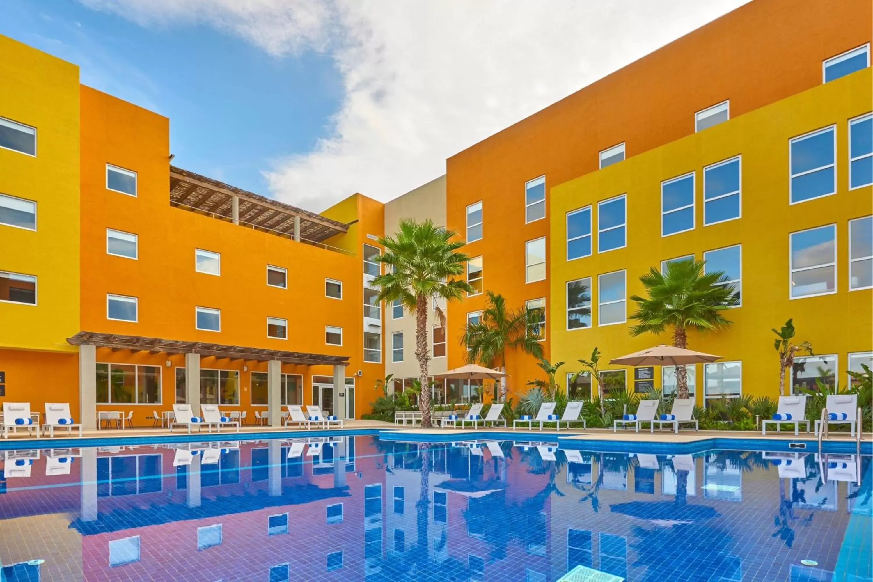 Swimming pool, Property Building in City Express Suites by Marriott Cabo San Lucas