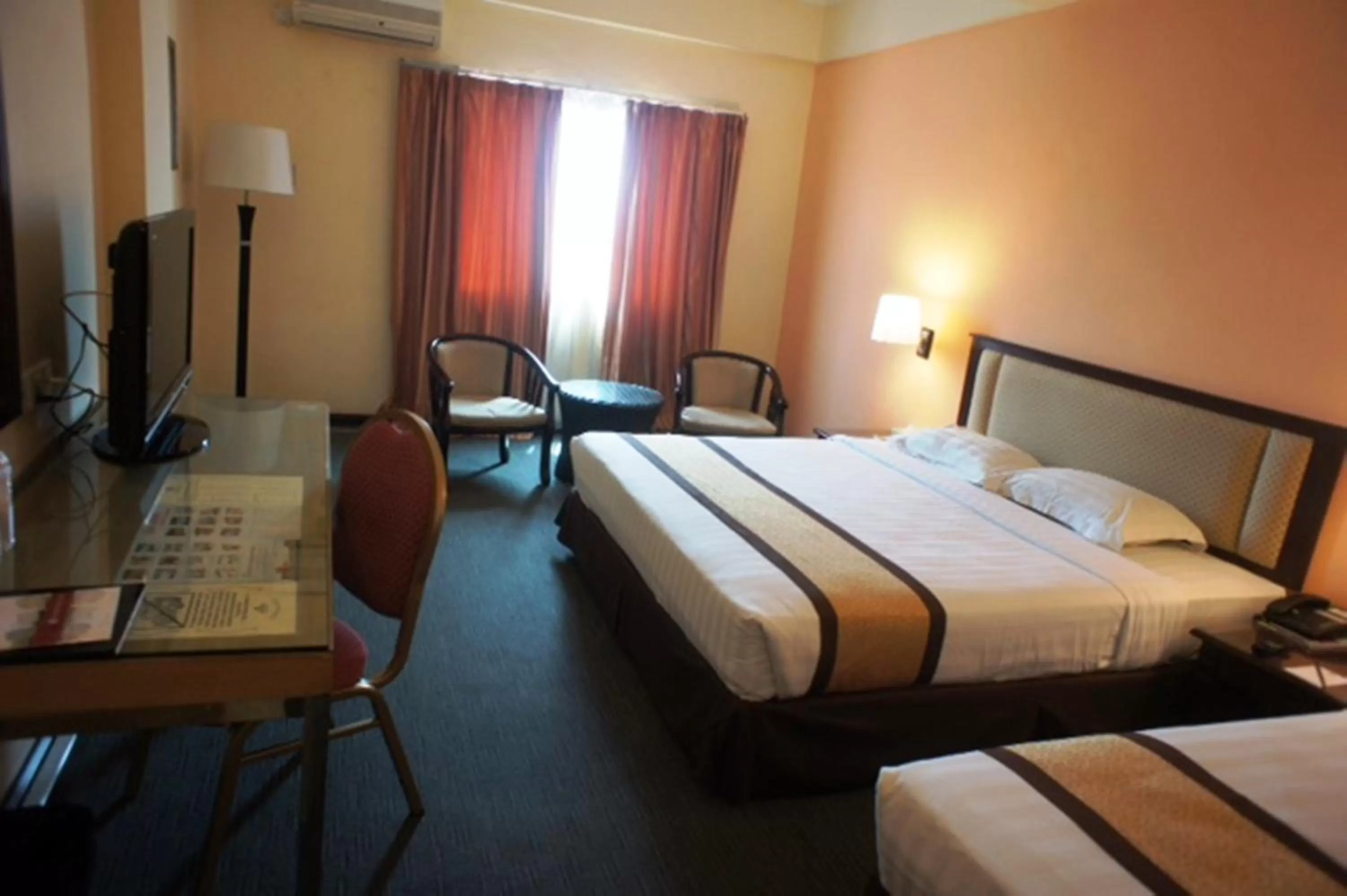 Bed in Tyng Garden Hotel