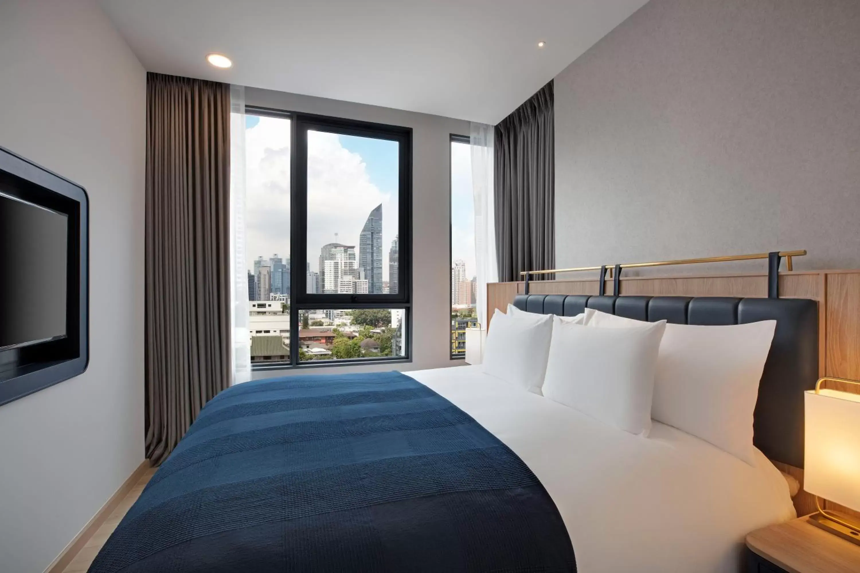 Bed in Staybridge Suites Bangkok Thonglor, an IHG Hotel