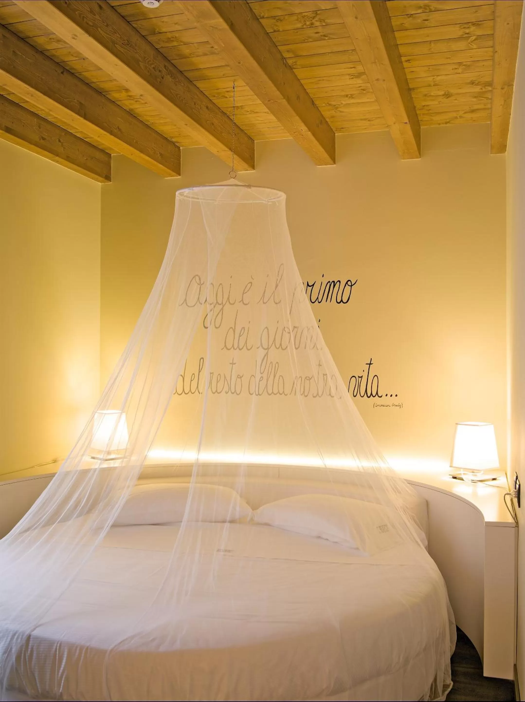 Bed in Harmony Suite Hotel