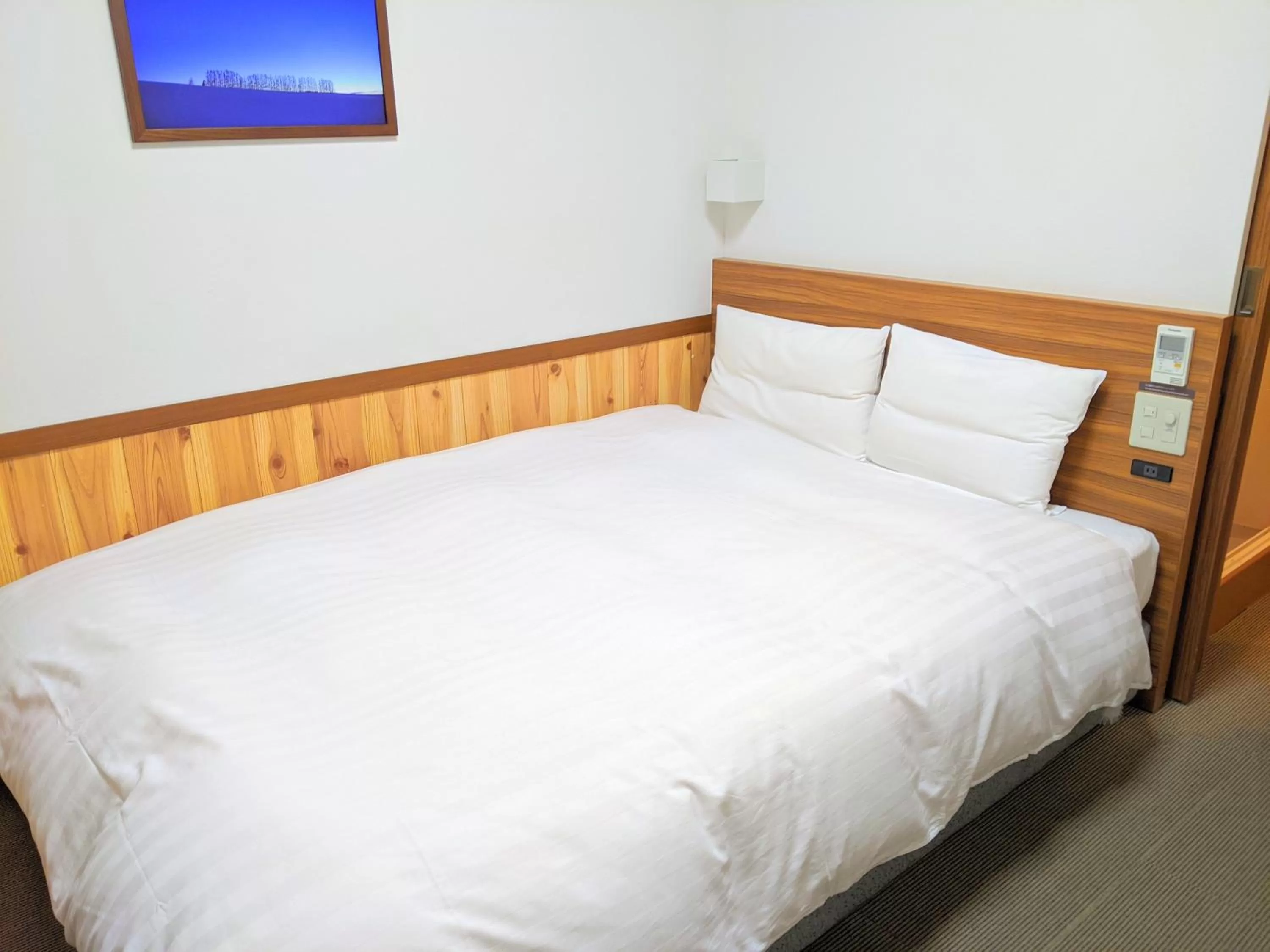 Bed in Dormy Inn Premium Sapporo