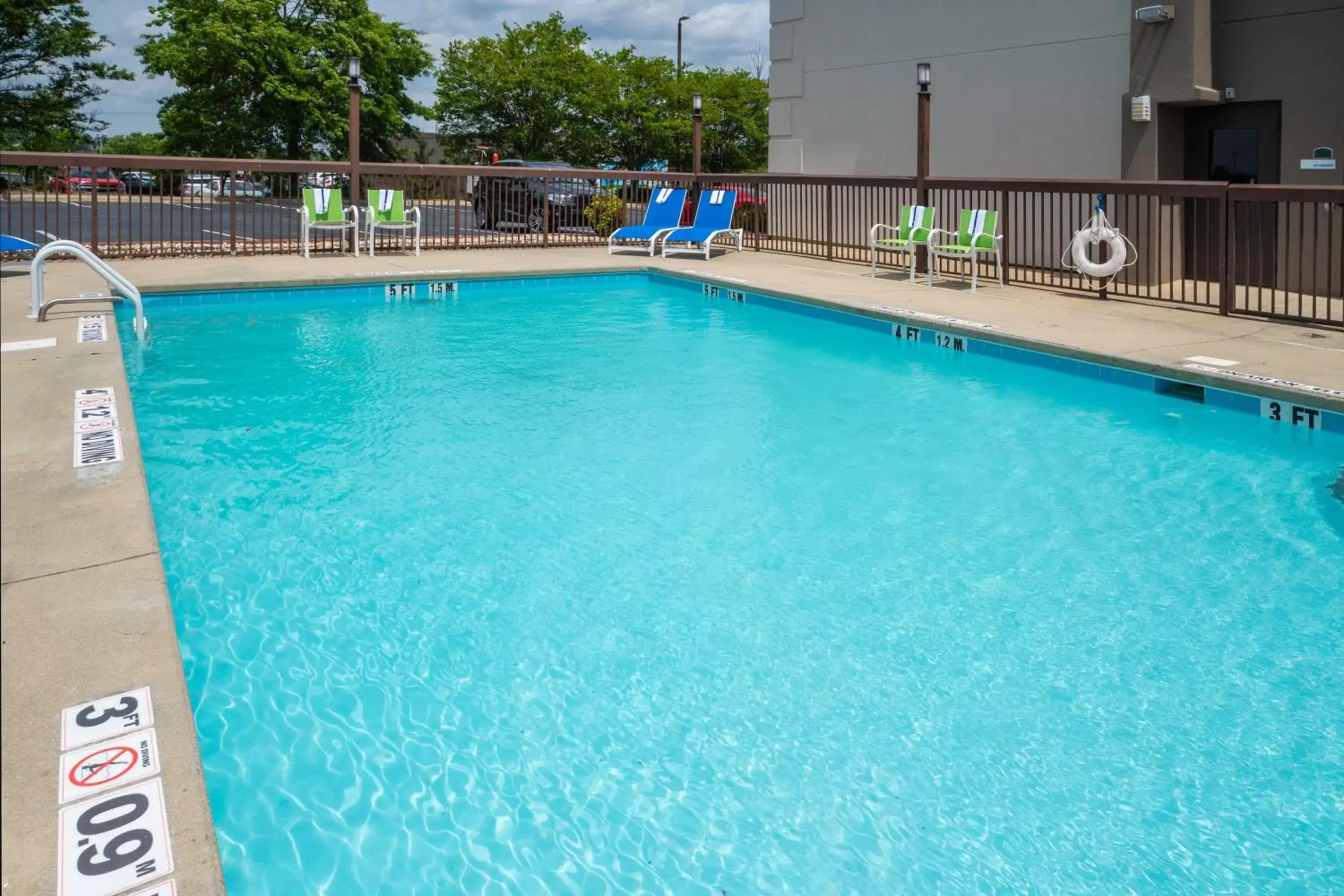 Swimming pool in Holiday Inn Express Clayton Southeast Raleigh, an IHG Hotel