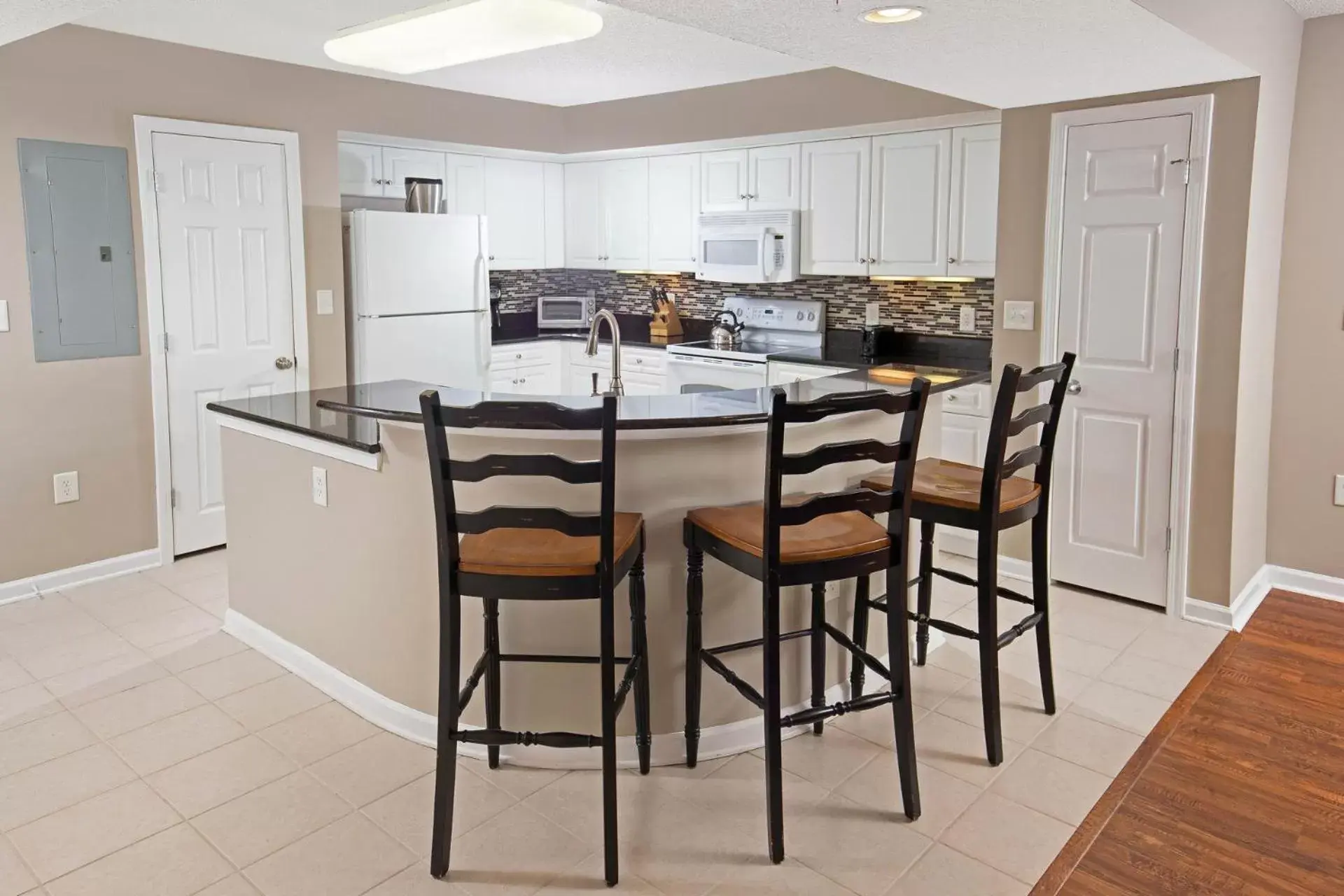 Kitchen or kitchenette, Dining Area in Barefoot Resort Golf & Yacht Club Villas