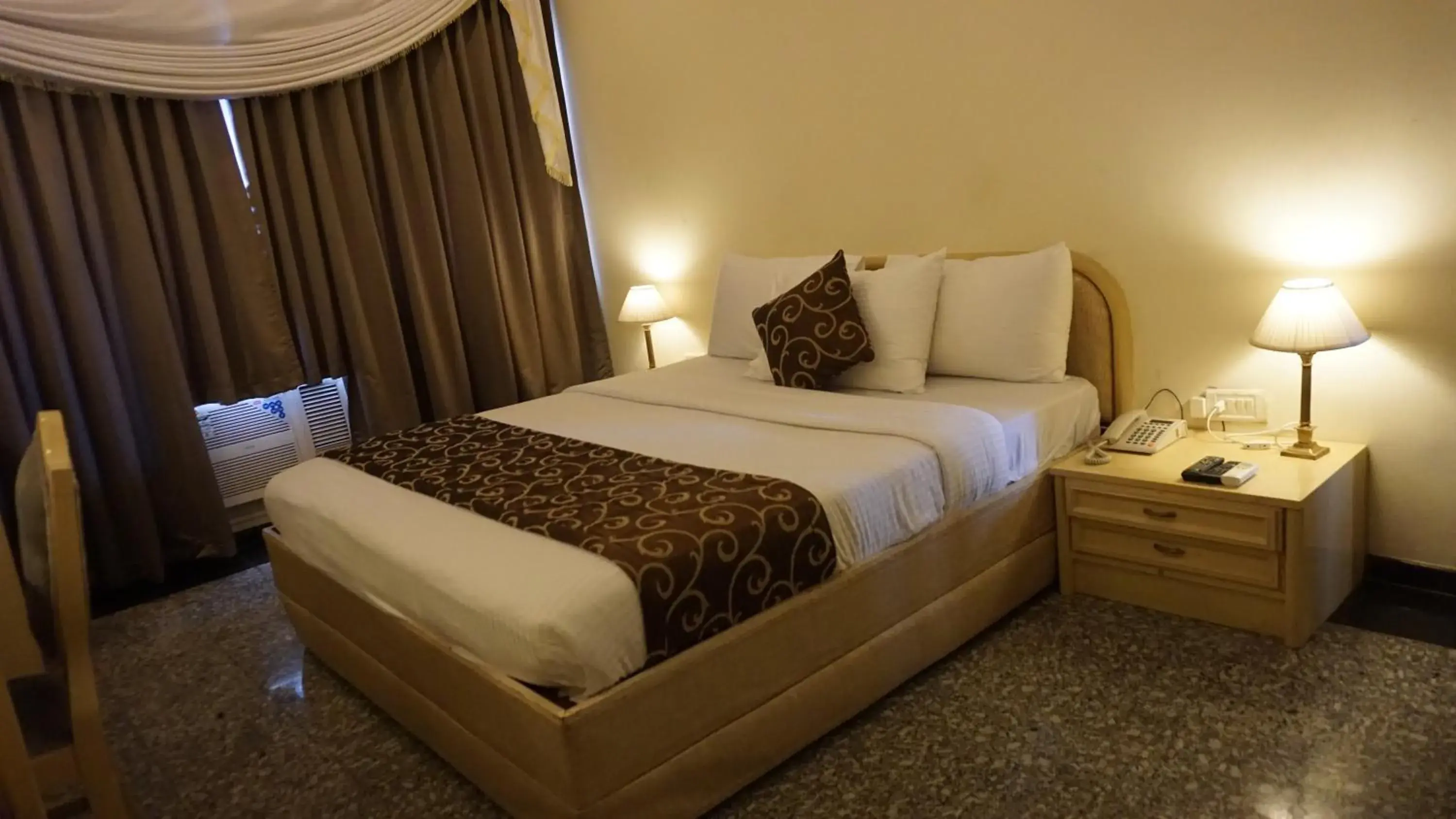 Bed in Hotel Poonja International