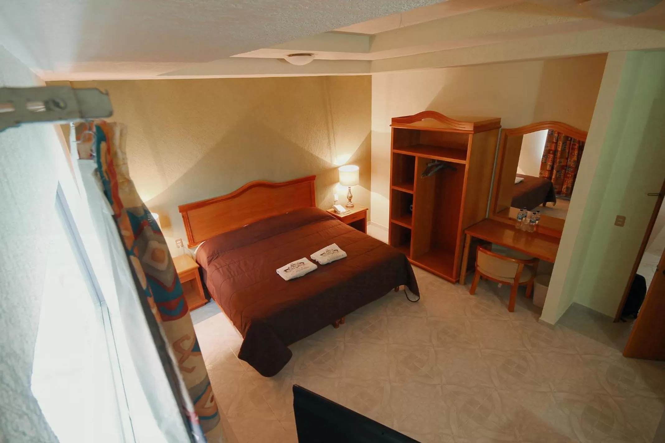 Bed in HOTEL EL CONQUISTADOR MONARCA.