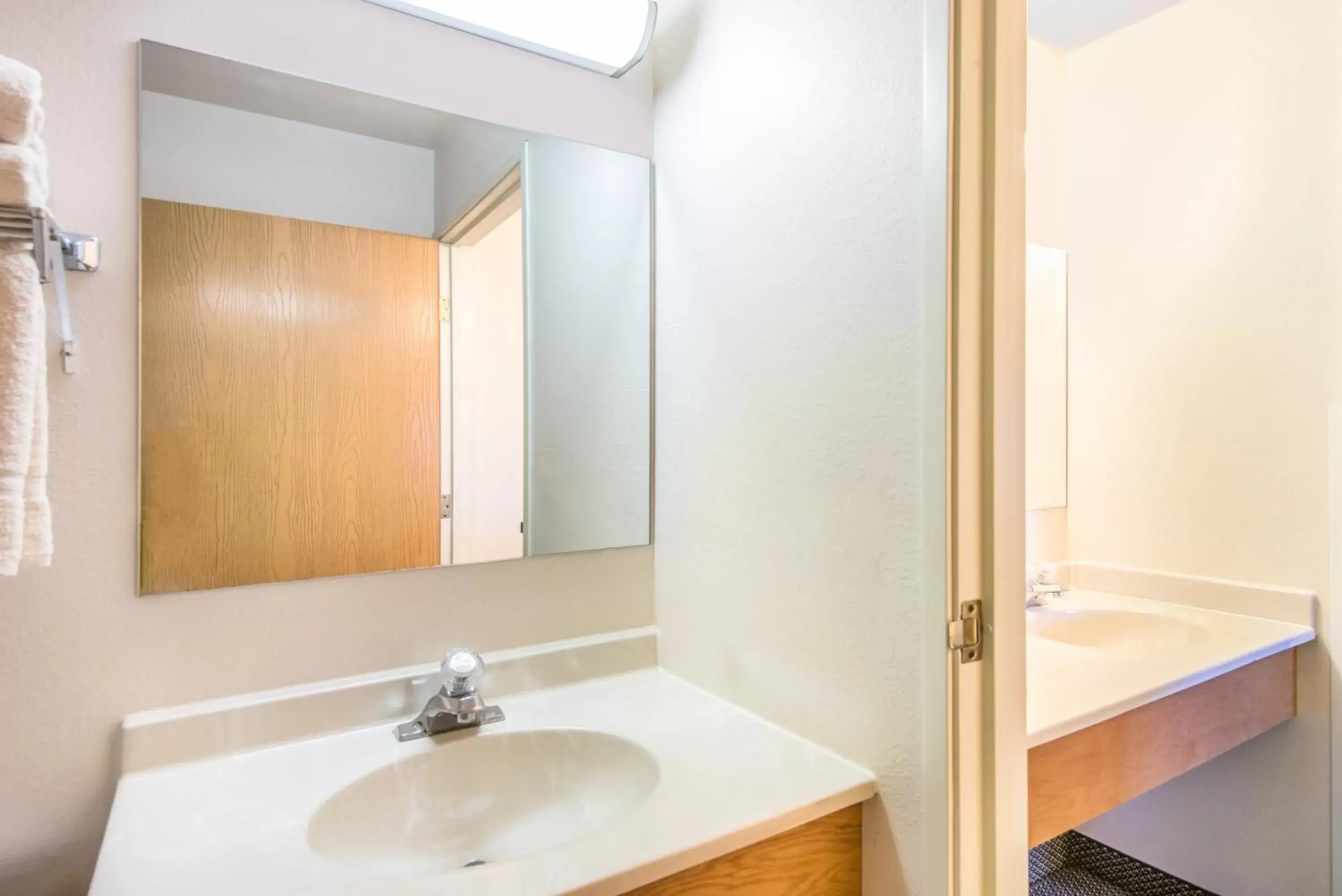 Bathroom in Super 8 by Wyndham West Middlesex/Sharon Area