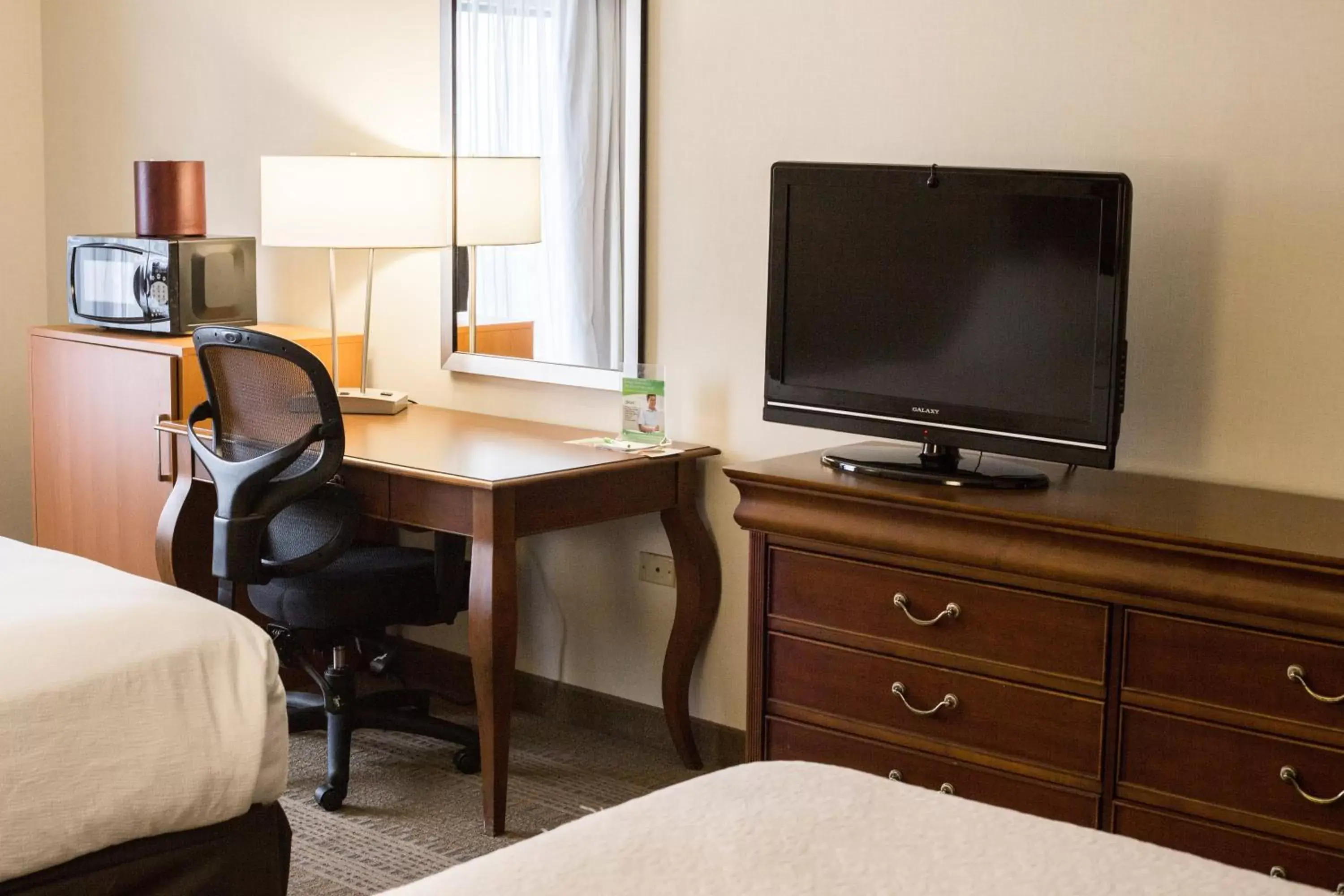 Photo of the whole room, TV/Entertainment Center in Holiday Inn Hotel & Suites Bolingbrook, an IHG Hotel