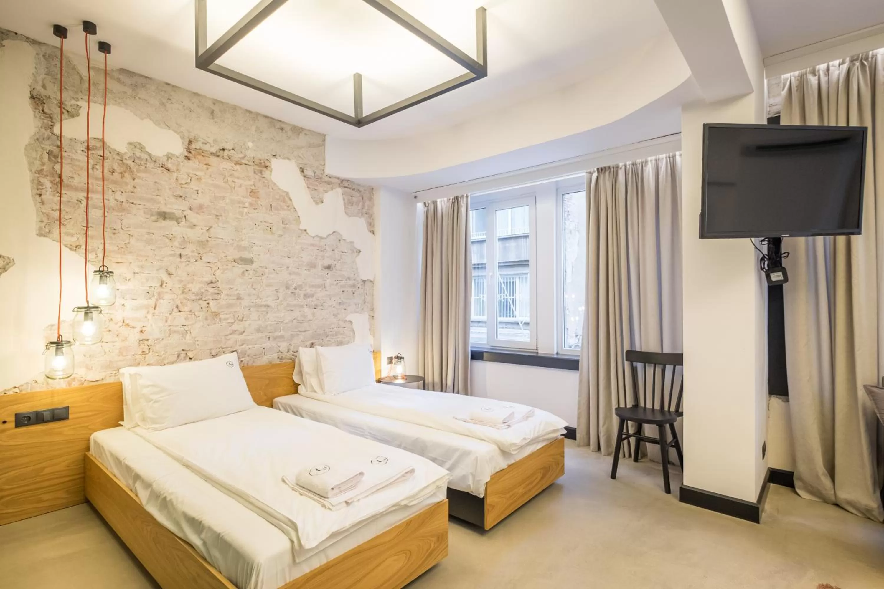 Bed in R34 Boutique Hotel