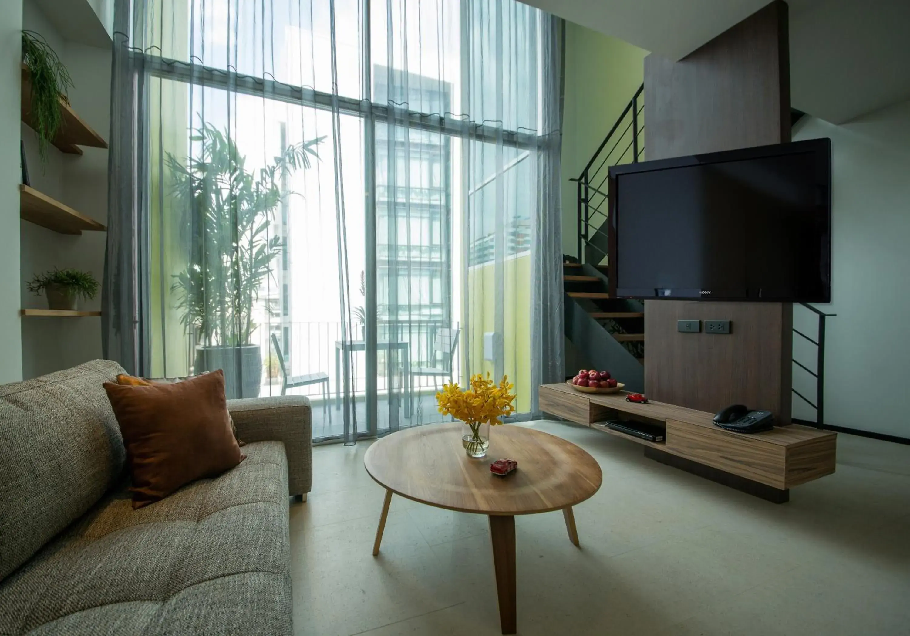 Living room, TV/Entertainment Center in LiT BANGKOK Residence - SHA Extra Plus