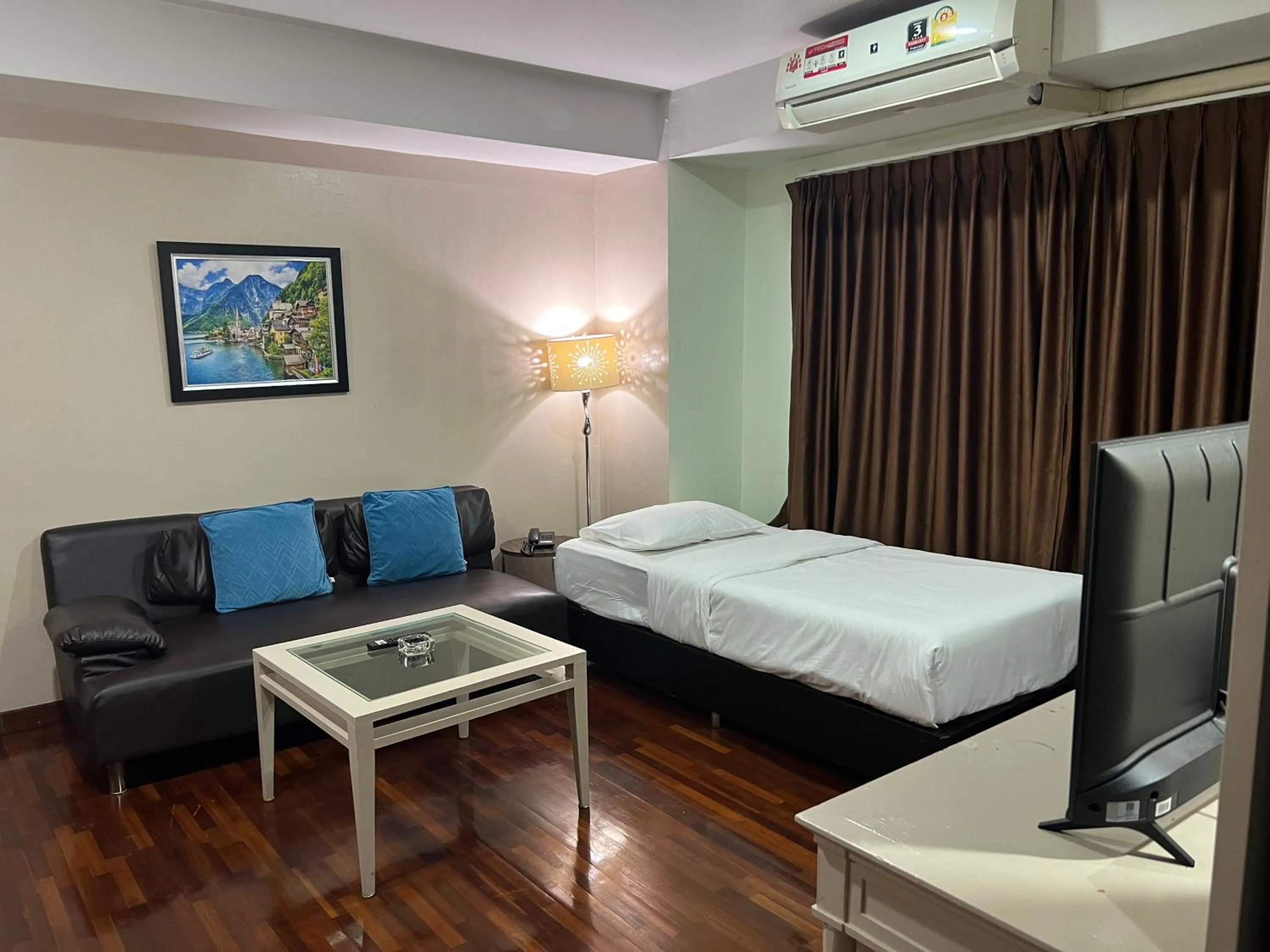 Bed in Mall Suites Hotel