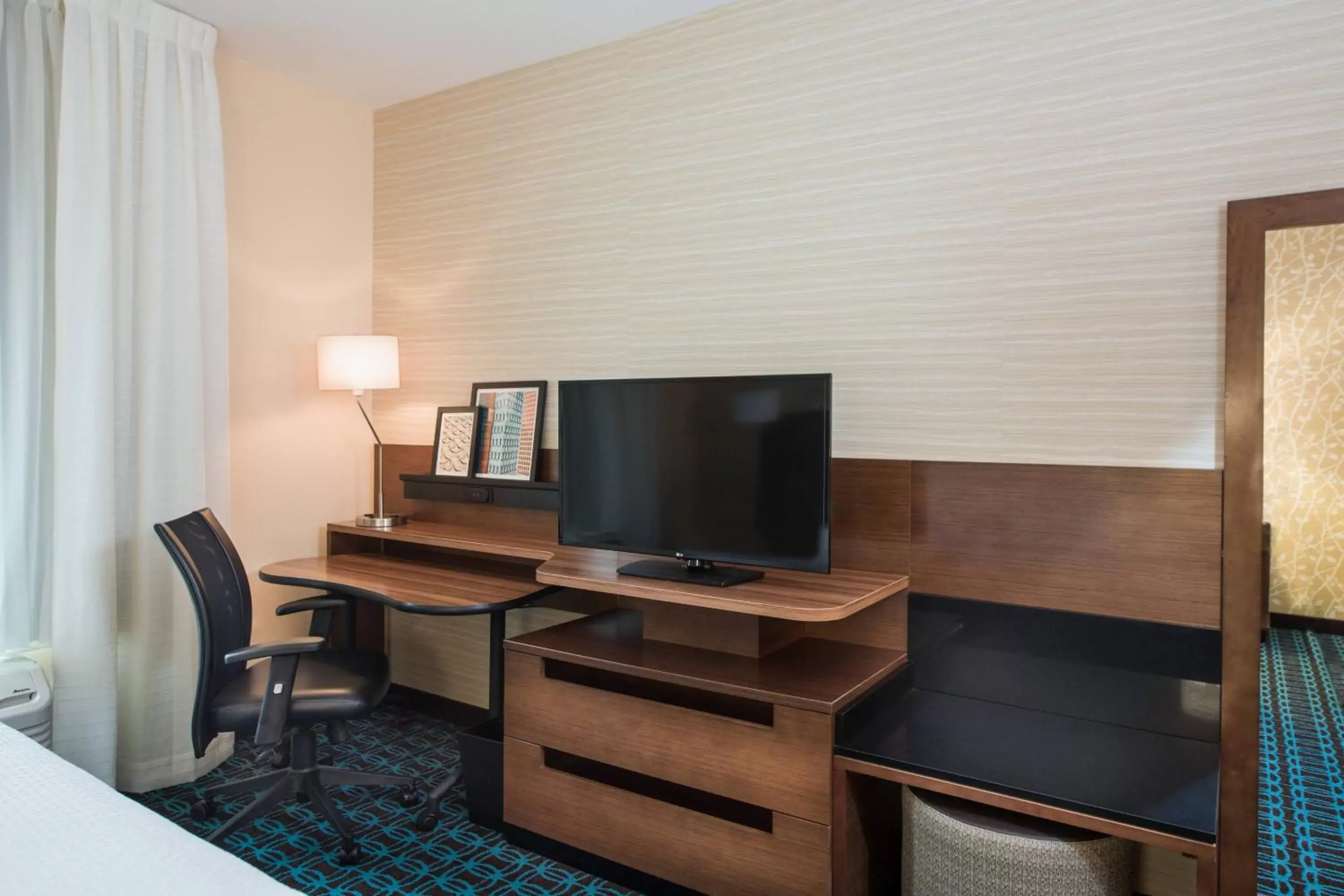 Photo of the whole room, TV/Entertainment Center in Fairfield Inn & Suites by Marriott Dayton