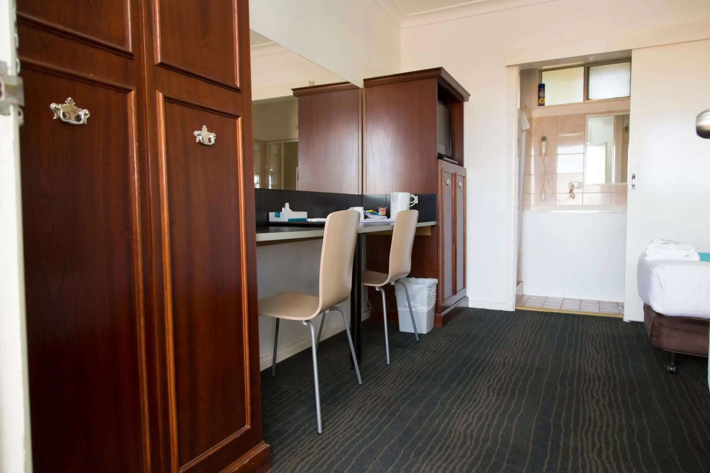 Photo of the whole room, TV/Entertainment Center in A Line Motel