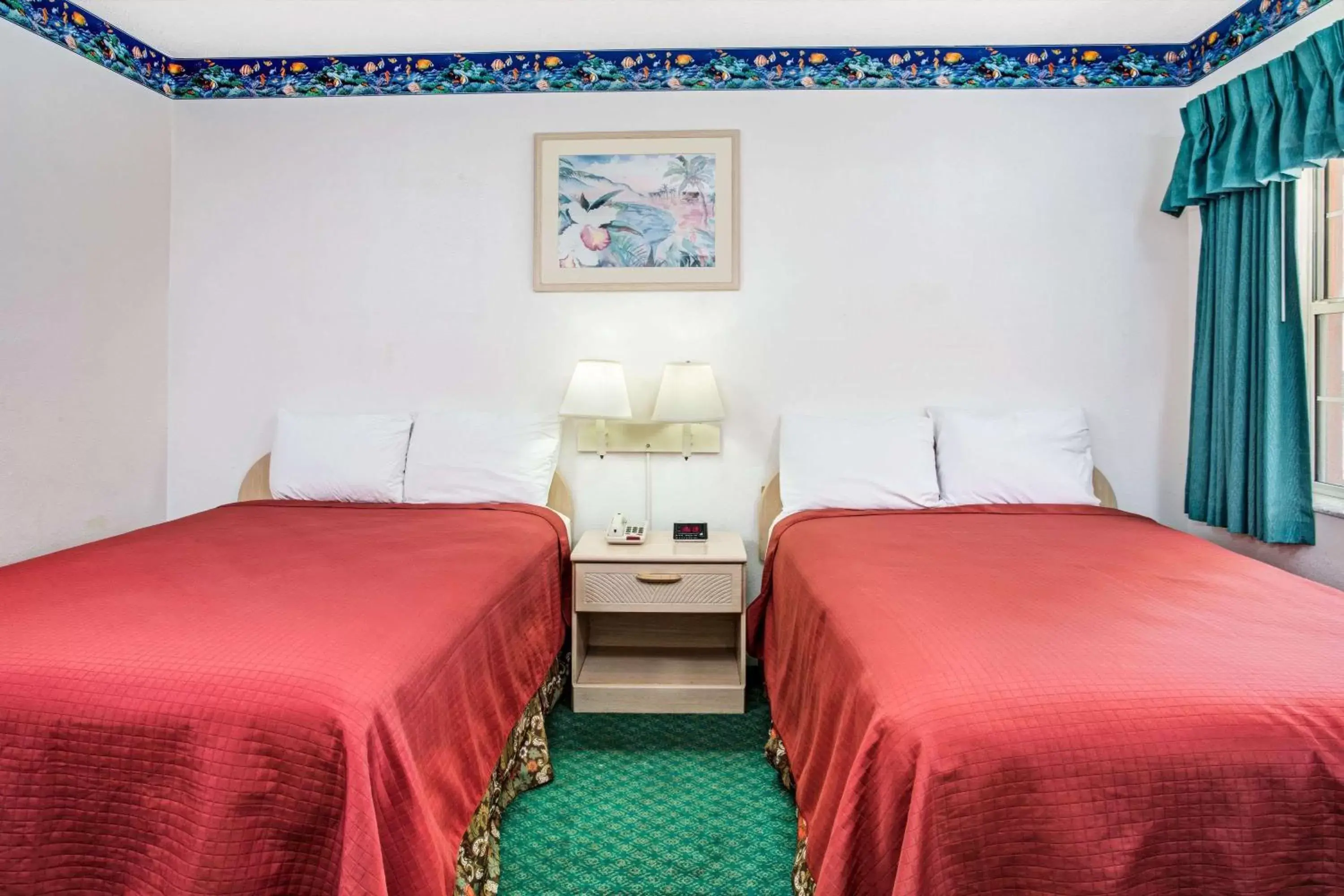 Bedroom, Bed in Travelodge by Wyndham Suites St Augustine