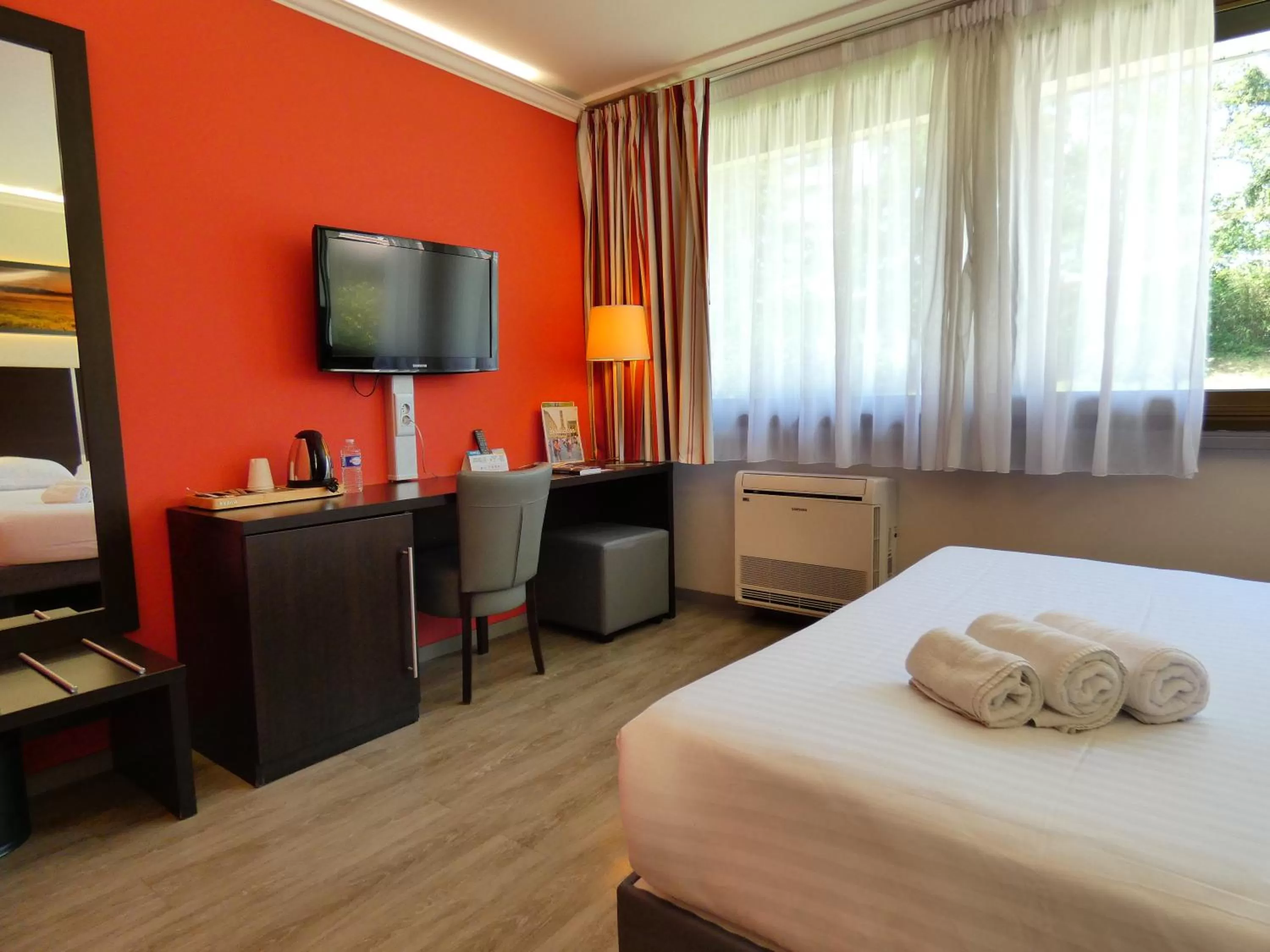 Bed in Logis Hotel Restaurant Black and Green Limoges Sud