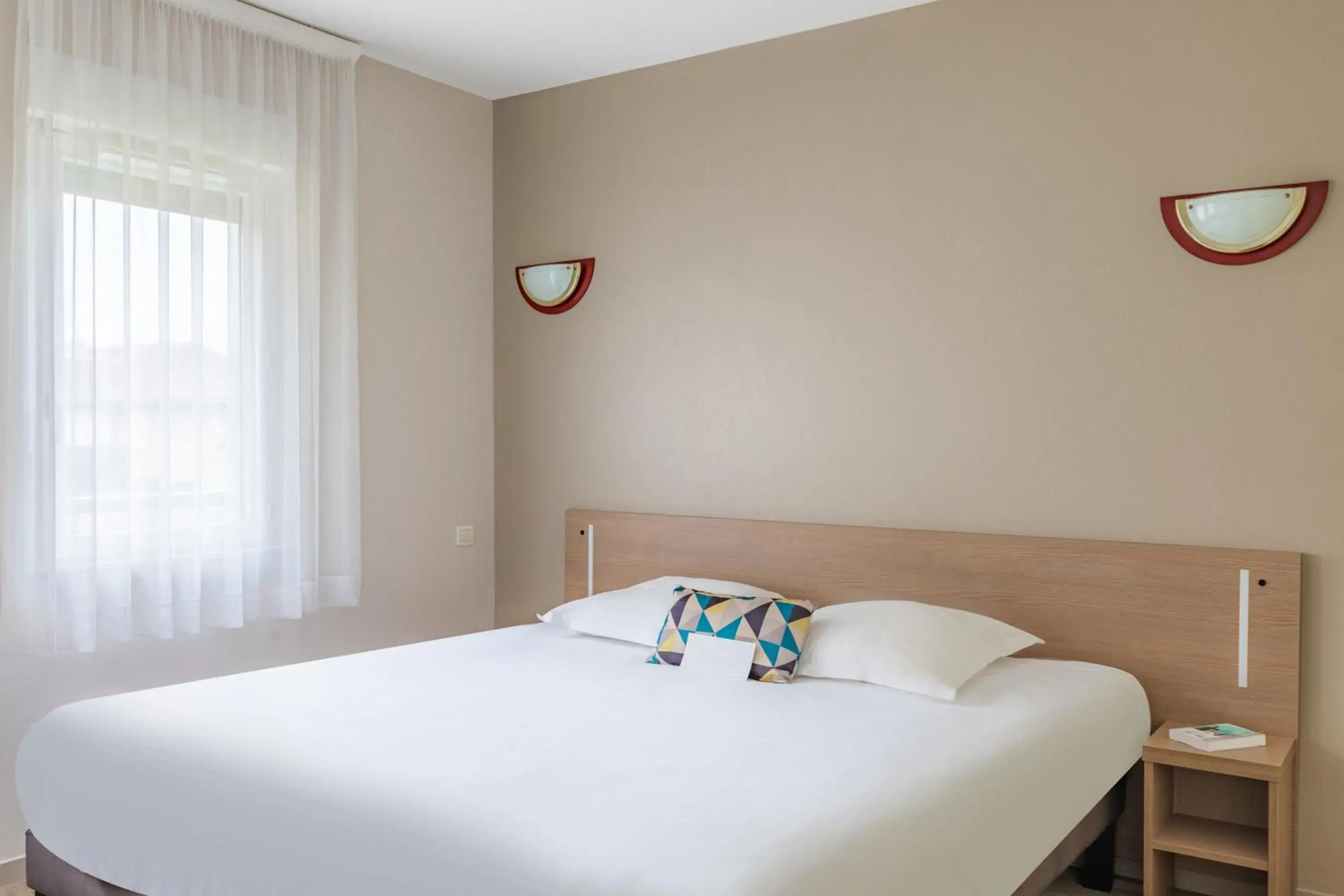 Bed in Appart'City Classic Limoges Bed in Appart'City Classic Limoges