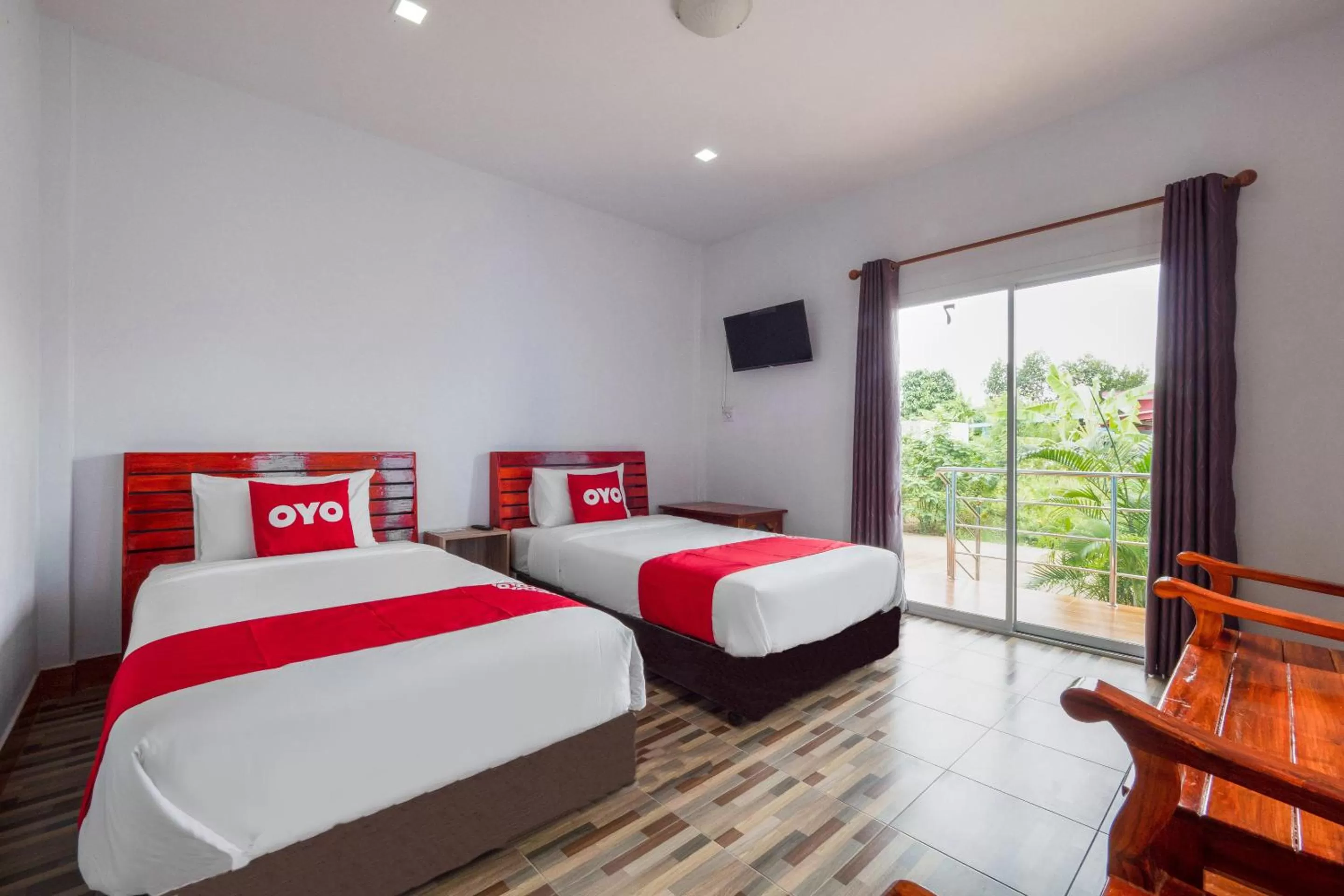 Bedroom in OYO 1044 Vassana Resort