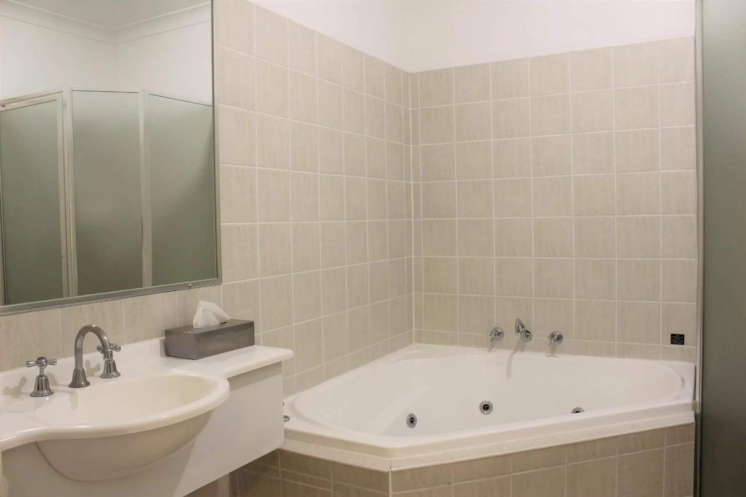 Bathroom in Carlyle Suites & Apartments