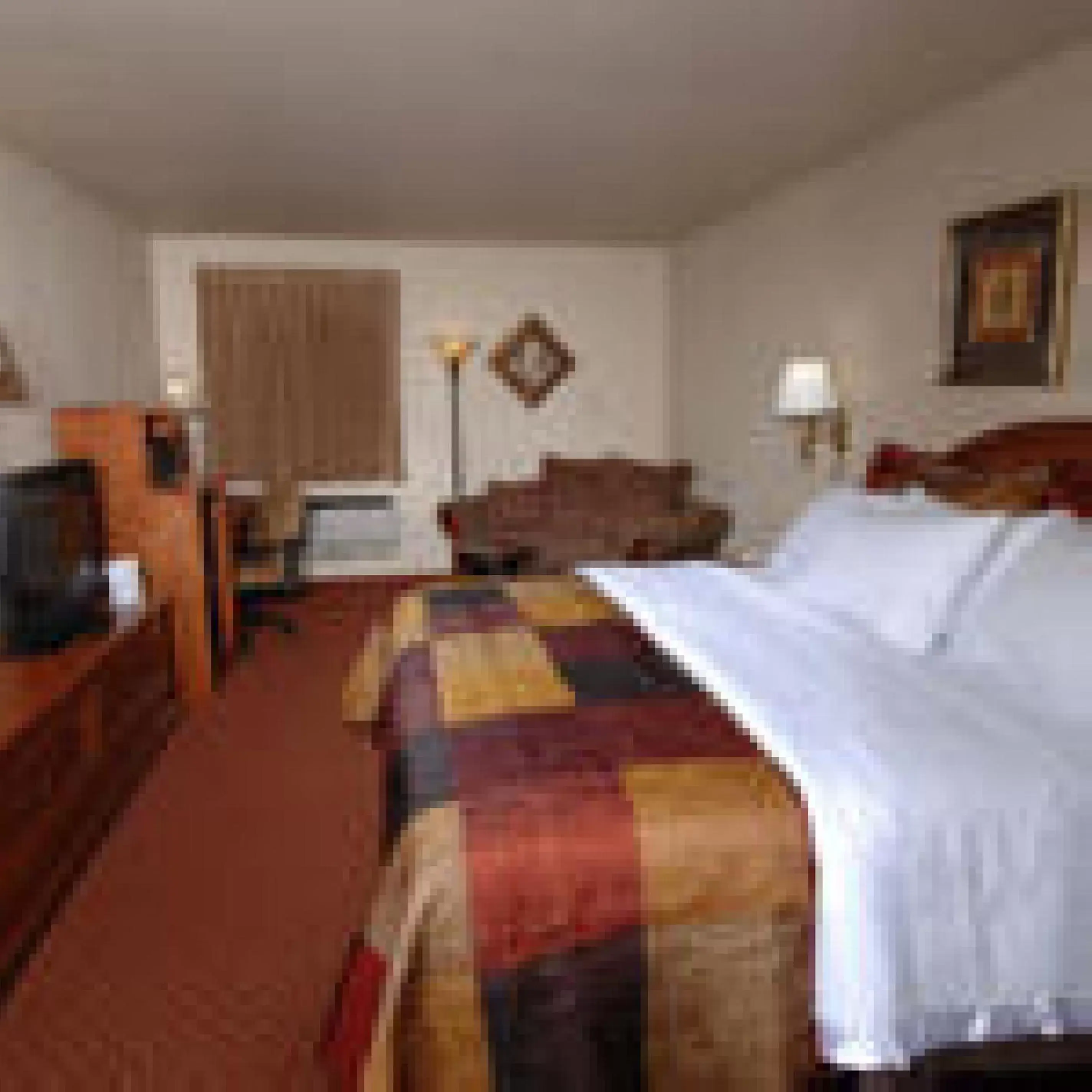 Bed in All American Inn & Suites Branson