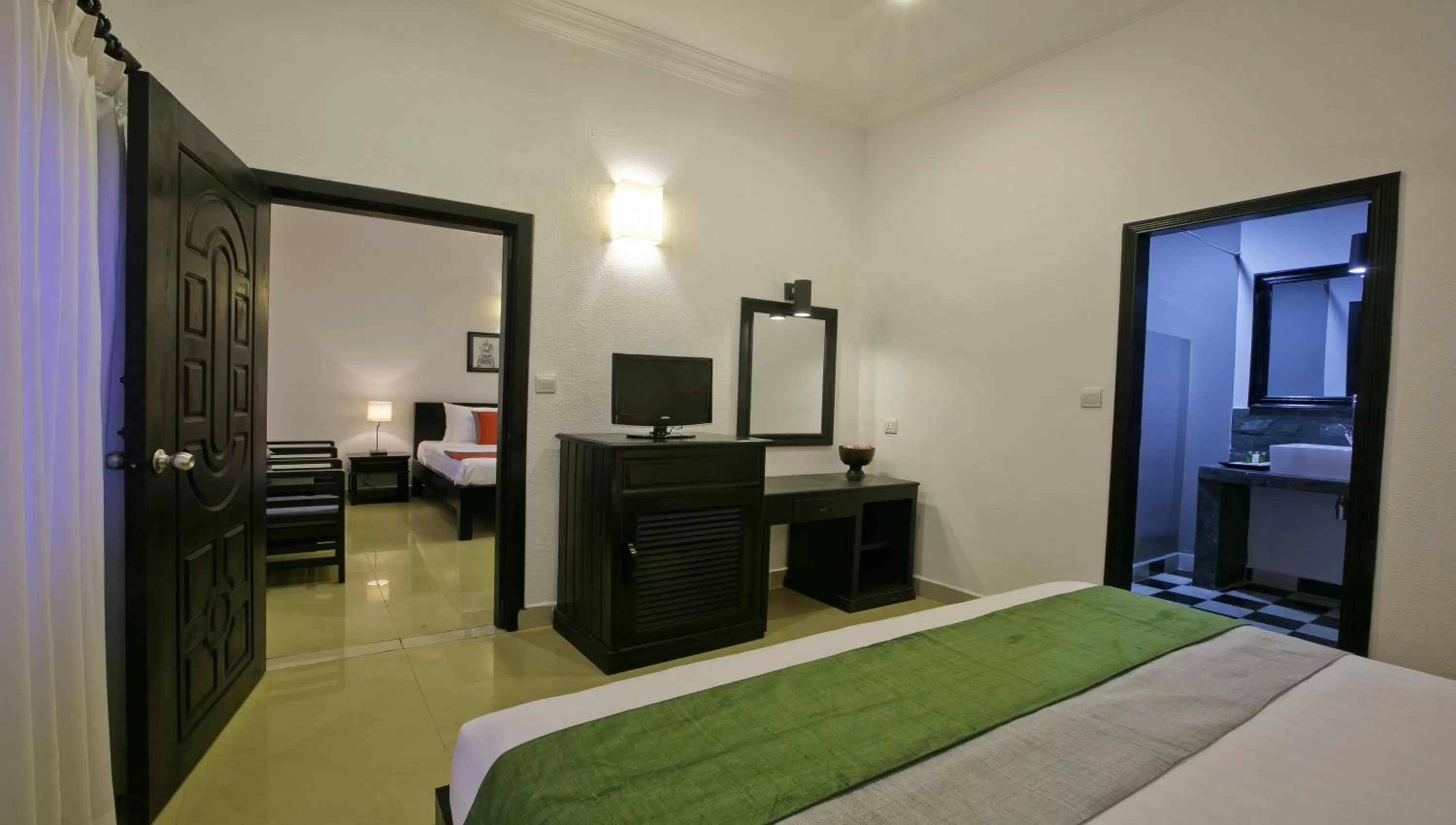 Bed in The Cyclo d'Angkor Boutique Hotel