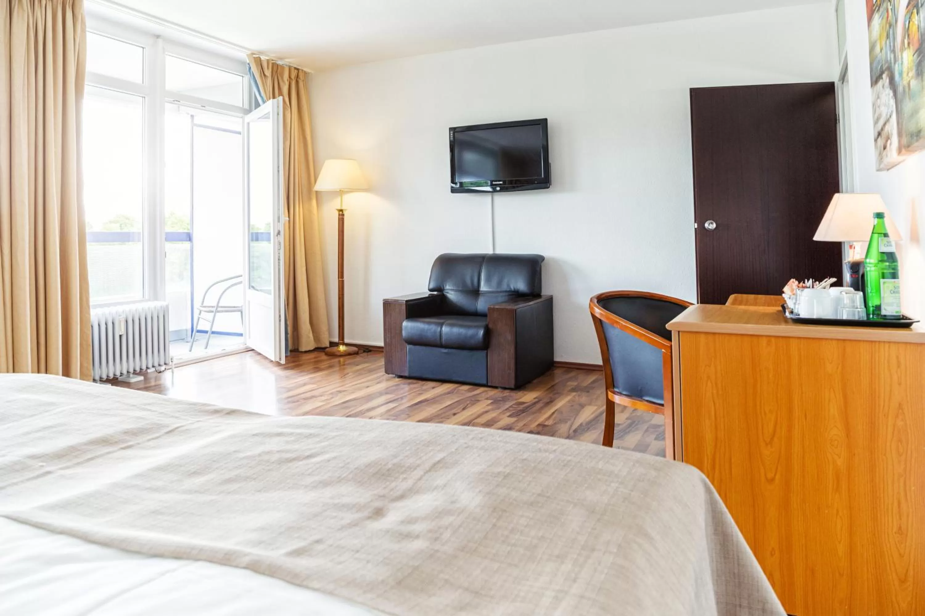 Photo of the whole room, Bed in Hotel Plöner See by Tulip Inn